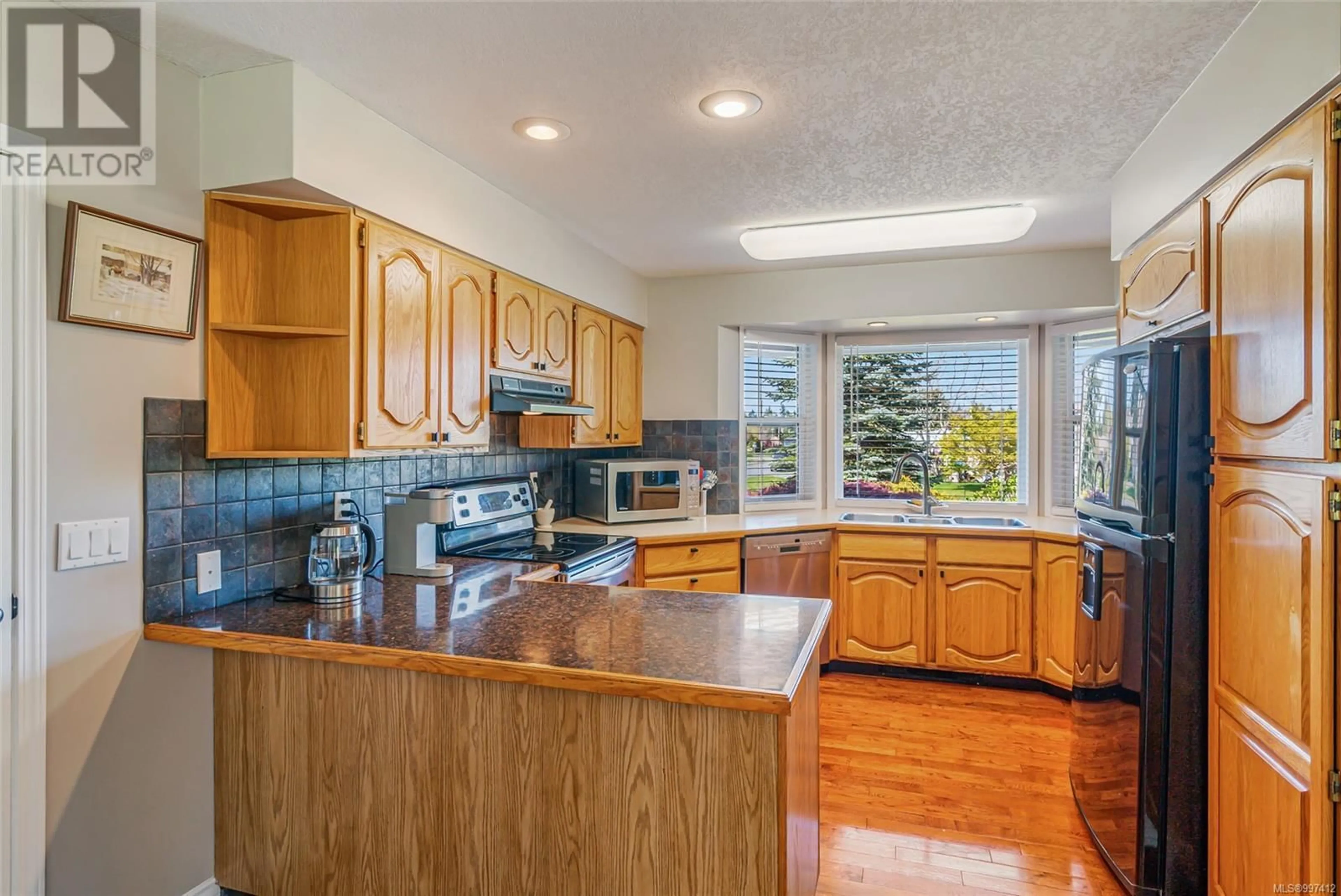 Open concept kitchen, ceramic/tile floor for 1310 LANYON DRIVE, Parksville British Columbia V9P1W6