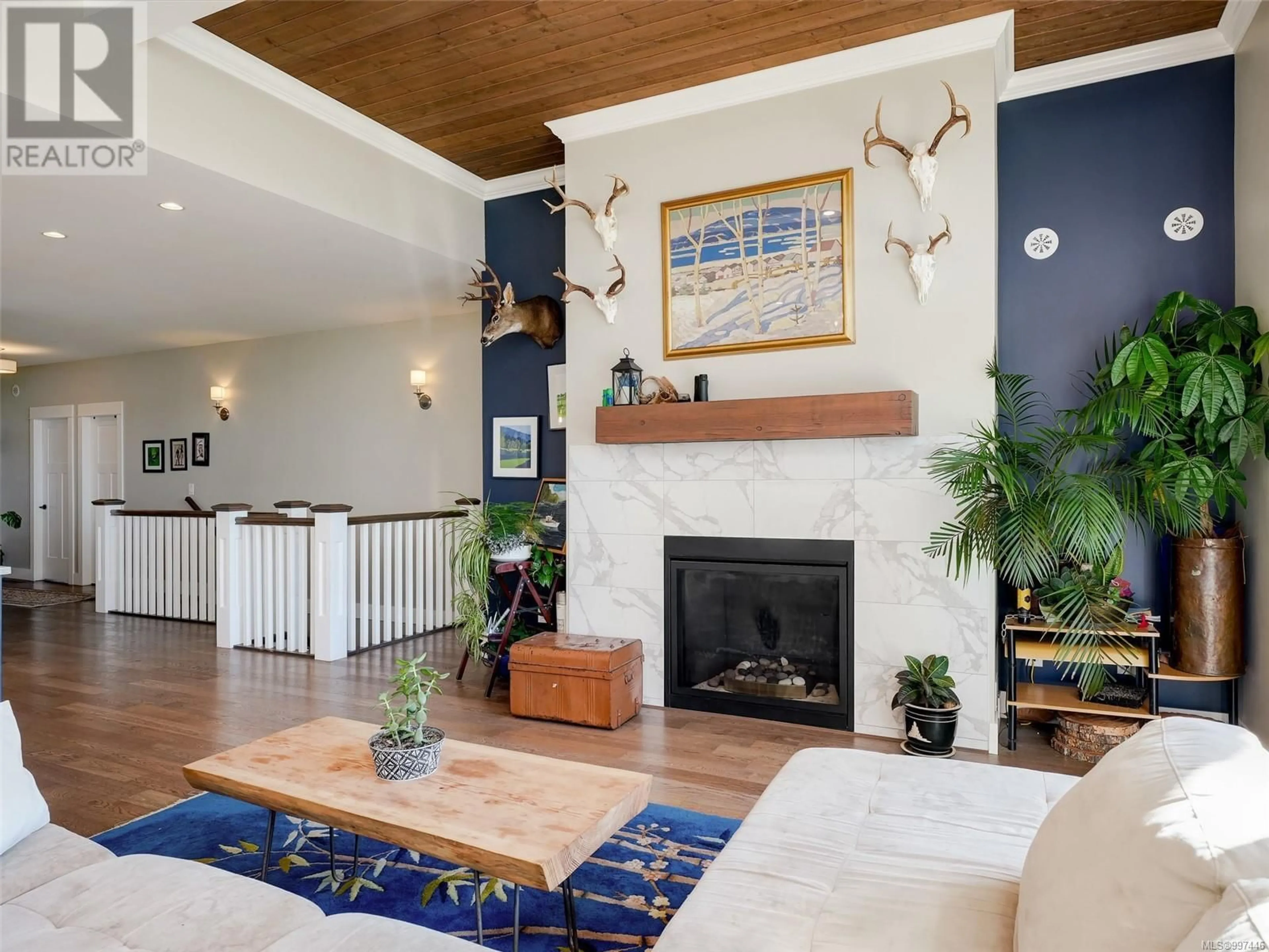 Living room with furniture, wood/laminate floor for 2325 MOUNTAIN HEIGHTS DRIVE, Sooke British Columbia V9Z1M4