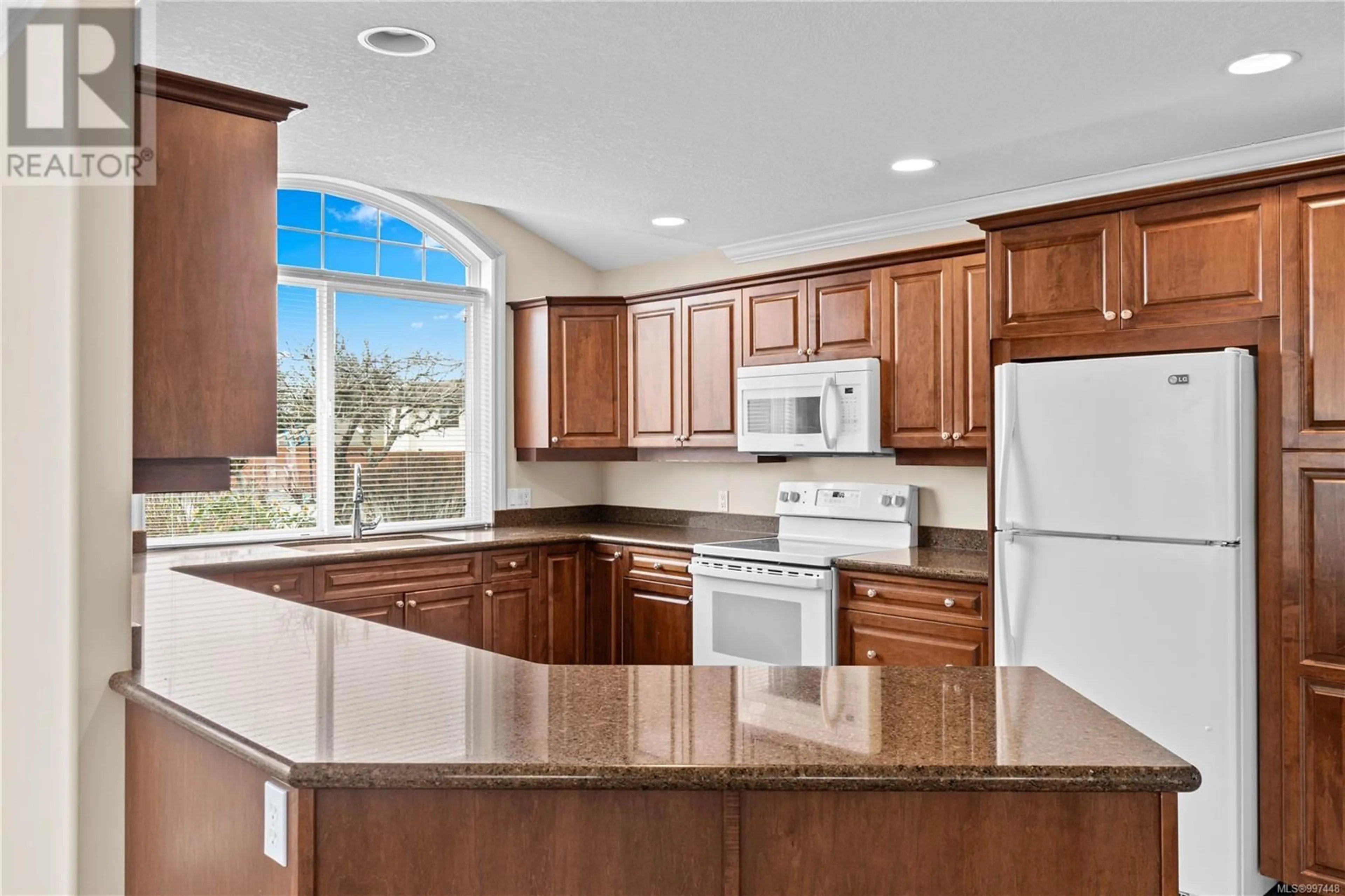 Open concept kitchen, ceramic/tile floor for 696 LYNX PLACE, Qualicum Beach British Columbia V9K2P3