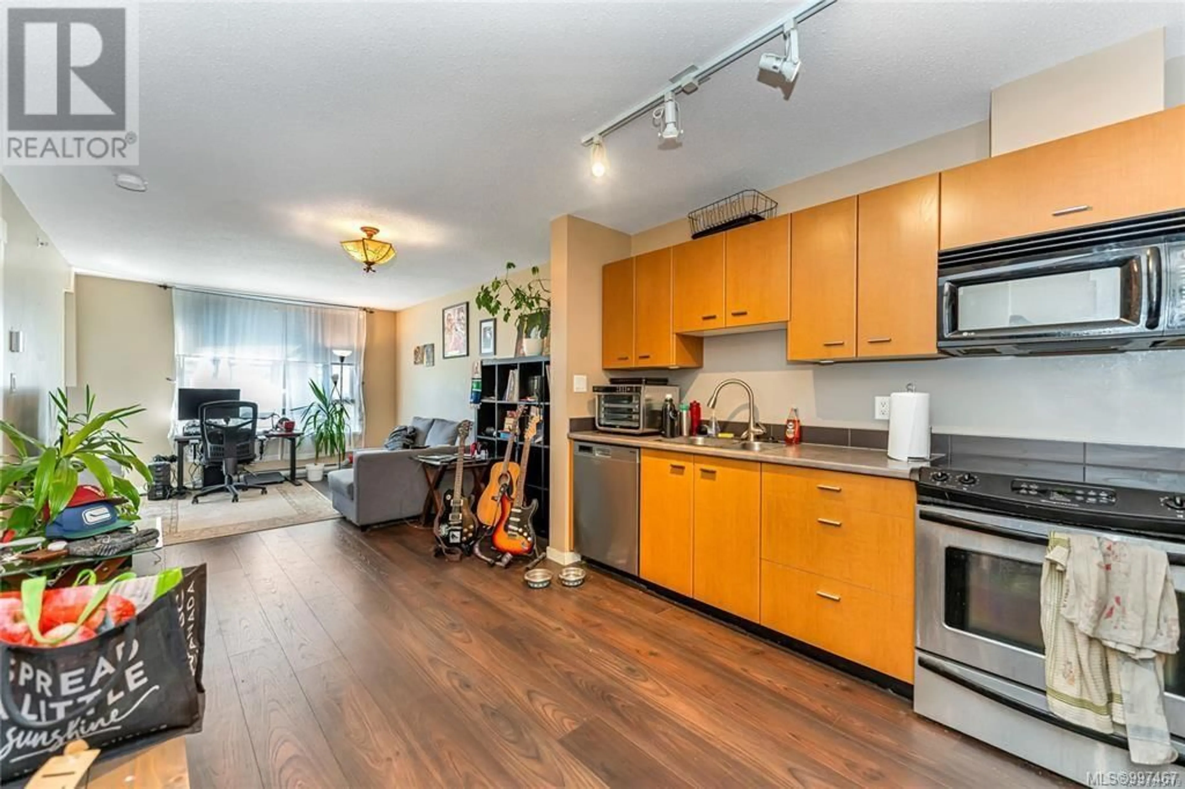 Open concept kitchen, wood/laminate floor for 206 - 751 FAIRFIELD ROAD, Victoria British Columbia V8S4G3