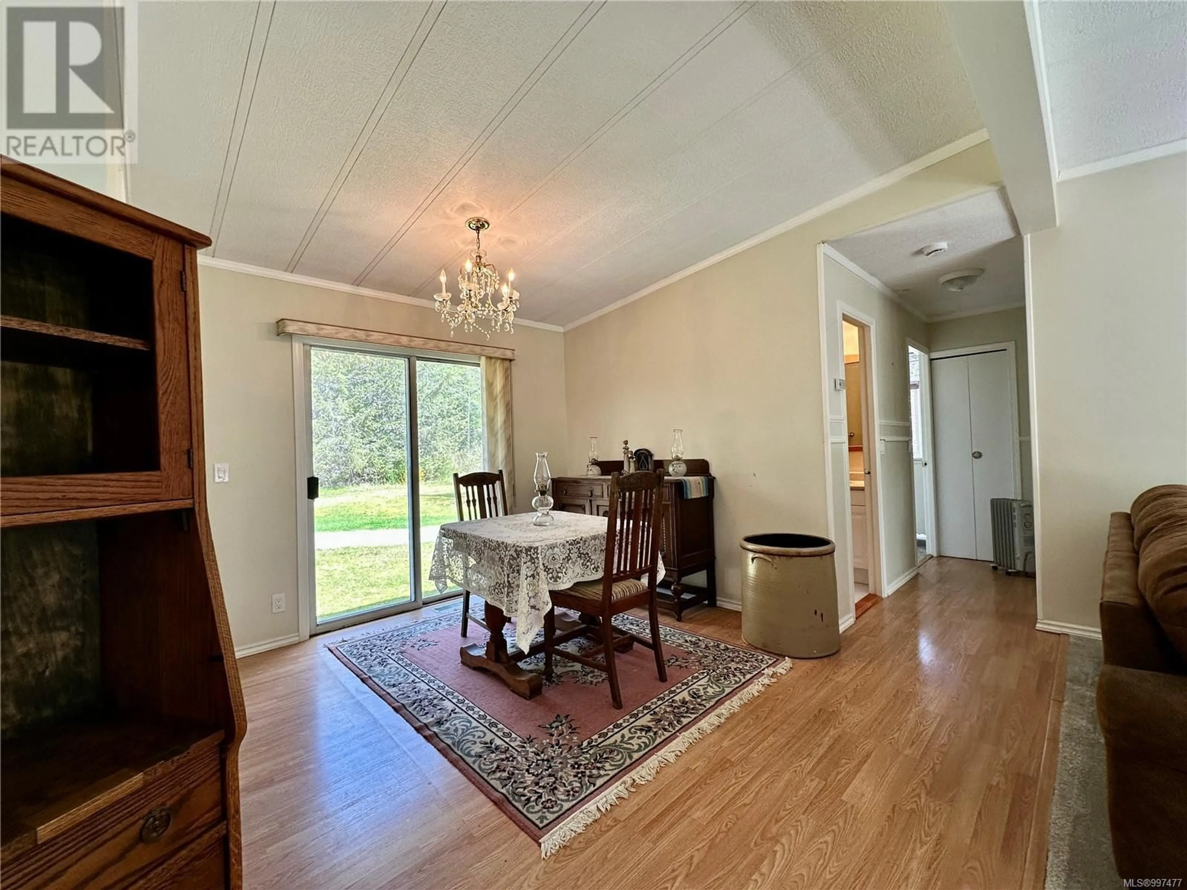 Dining room, wood/laminate floor for 901 NIMPKISH HEIGHTS ROAD, Hyde Creek British Columbia V0N2R0