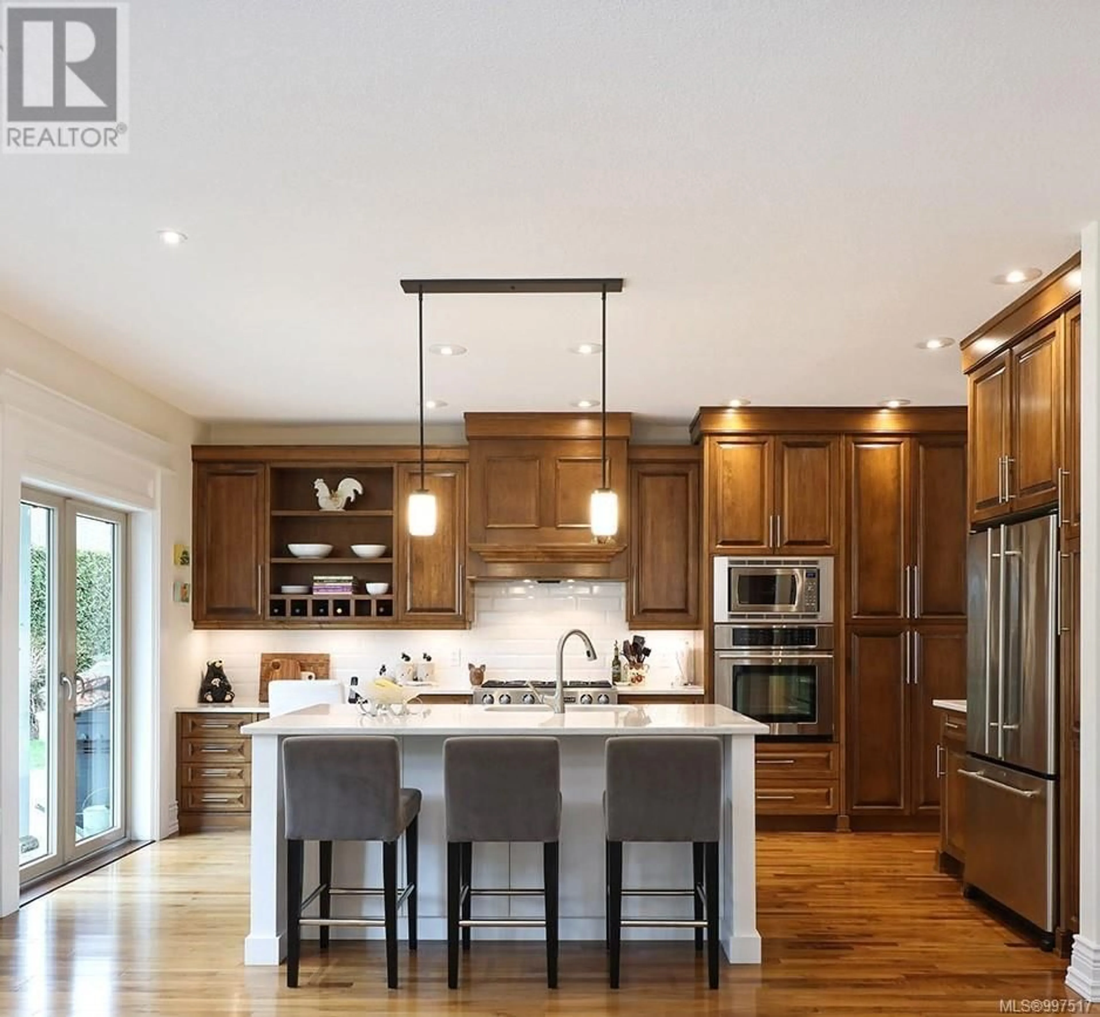 Open concept kitchen, wood/laminate floor for 842 BLUFFS DRIVE, Qualicum Beach British Columbia V9K0A2