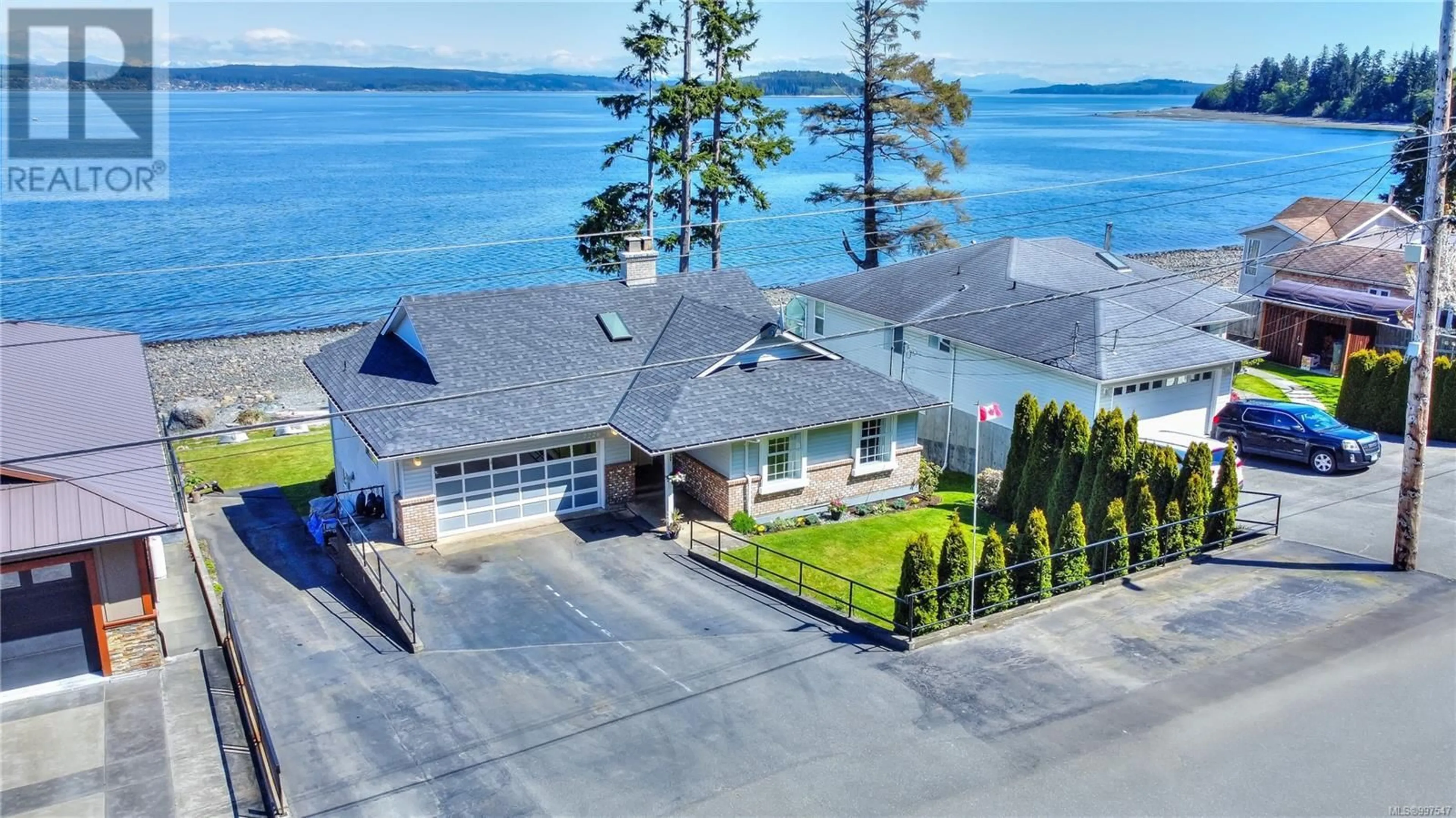 A pic from outside/outdoor area/front of a property/back of a property/a pic from drone, water/lake/river/ocean view for 2226 BEACH DRIVE, Port McNeill British Columbia V0N2R0