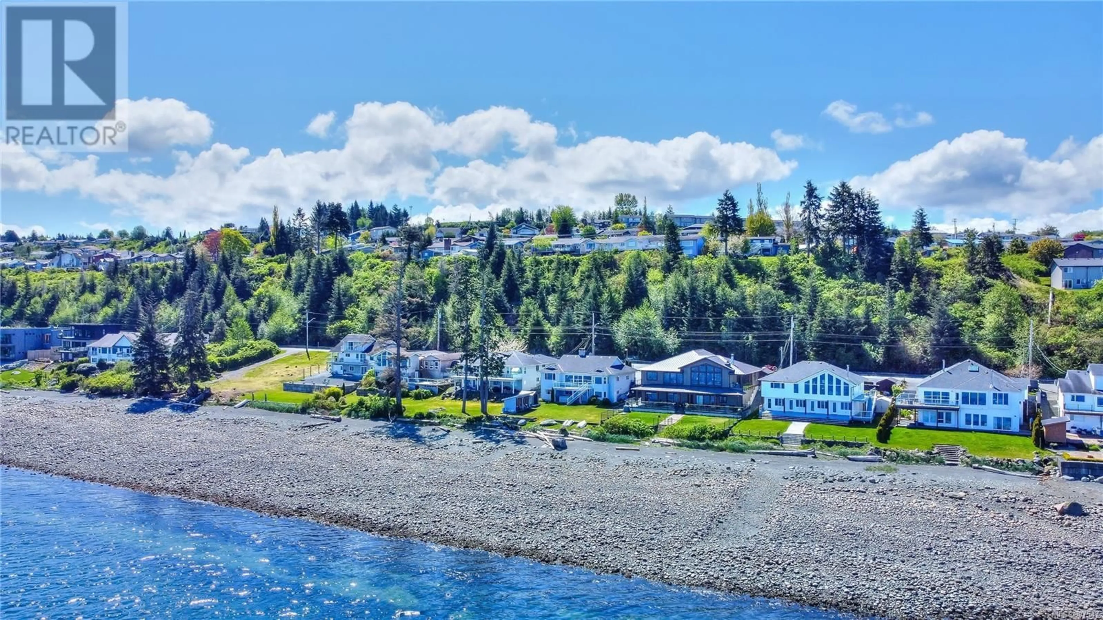 A pic from outside/outdoor area/front of a property/back of a property/a pic from drone, water/lake/river/ocean view for 2226 BEACH DRIVE, Port McNeill British Columbia V0N2R0
