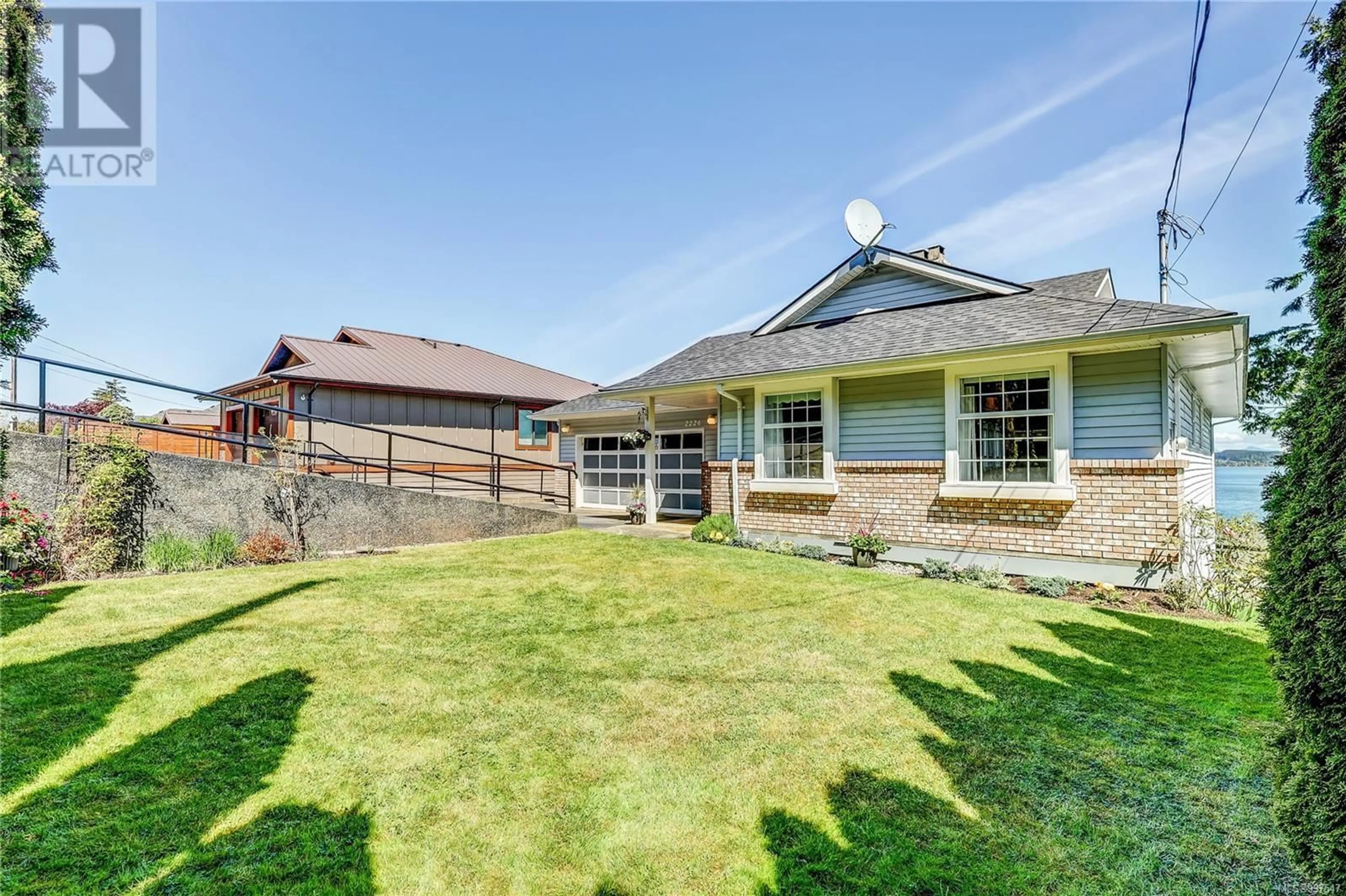 A pic from outside/outdoor area/front of a property/back of a property/a pic from drone, mountain view for 2226 BEACH DRIVE, Port McNeill British Columbia V0N2R0