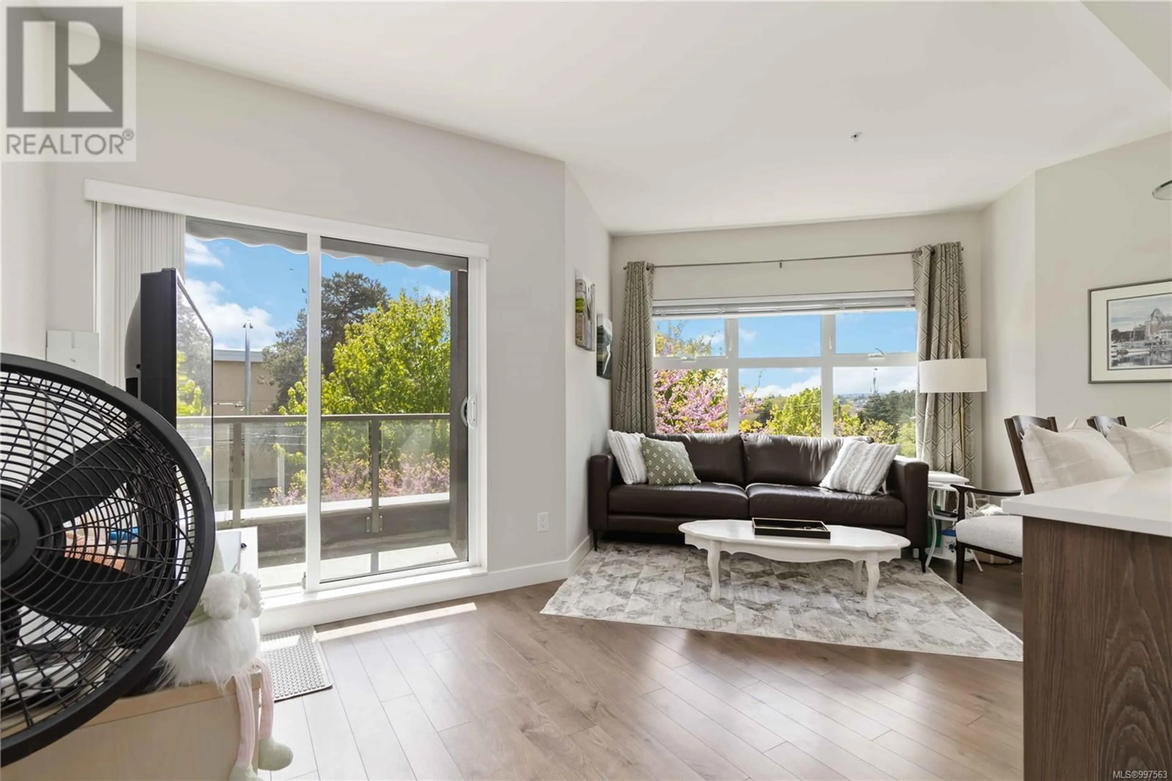 Living room with furniture, wood/laminate floor for 209 - 1000 INVERNESS ROAD, Saanich British Columbia V8X2S1