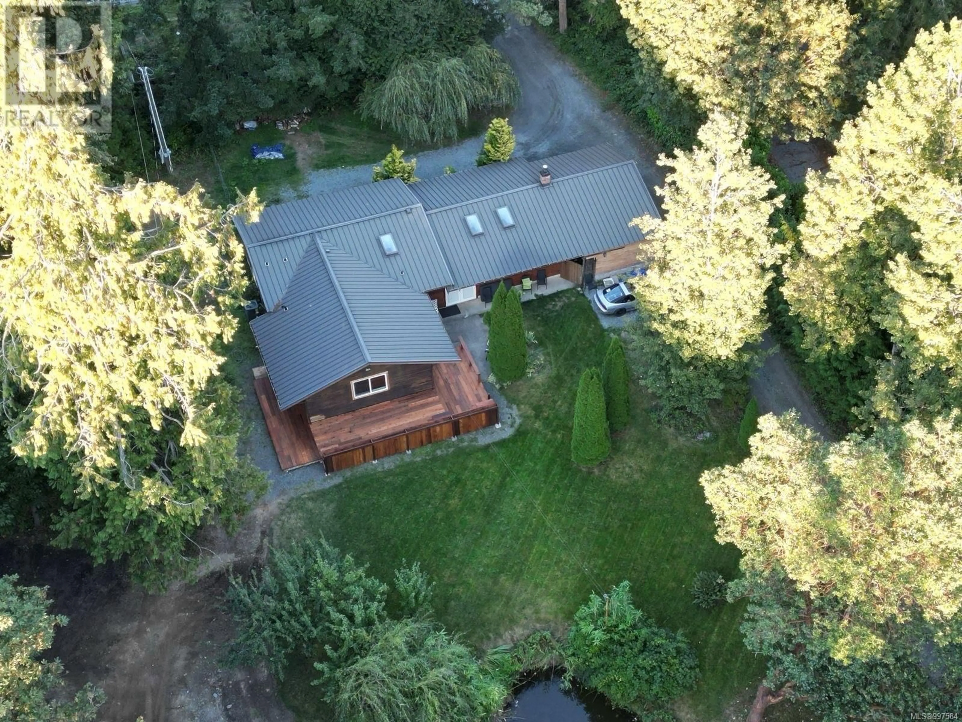 A pic from outside/outdoor area/front of a property/back of a property/a pic from drone, forest/trees view for 3420 TRANS CANADA HIGHWAY, Cobble Hill British Columbia V0R1L0