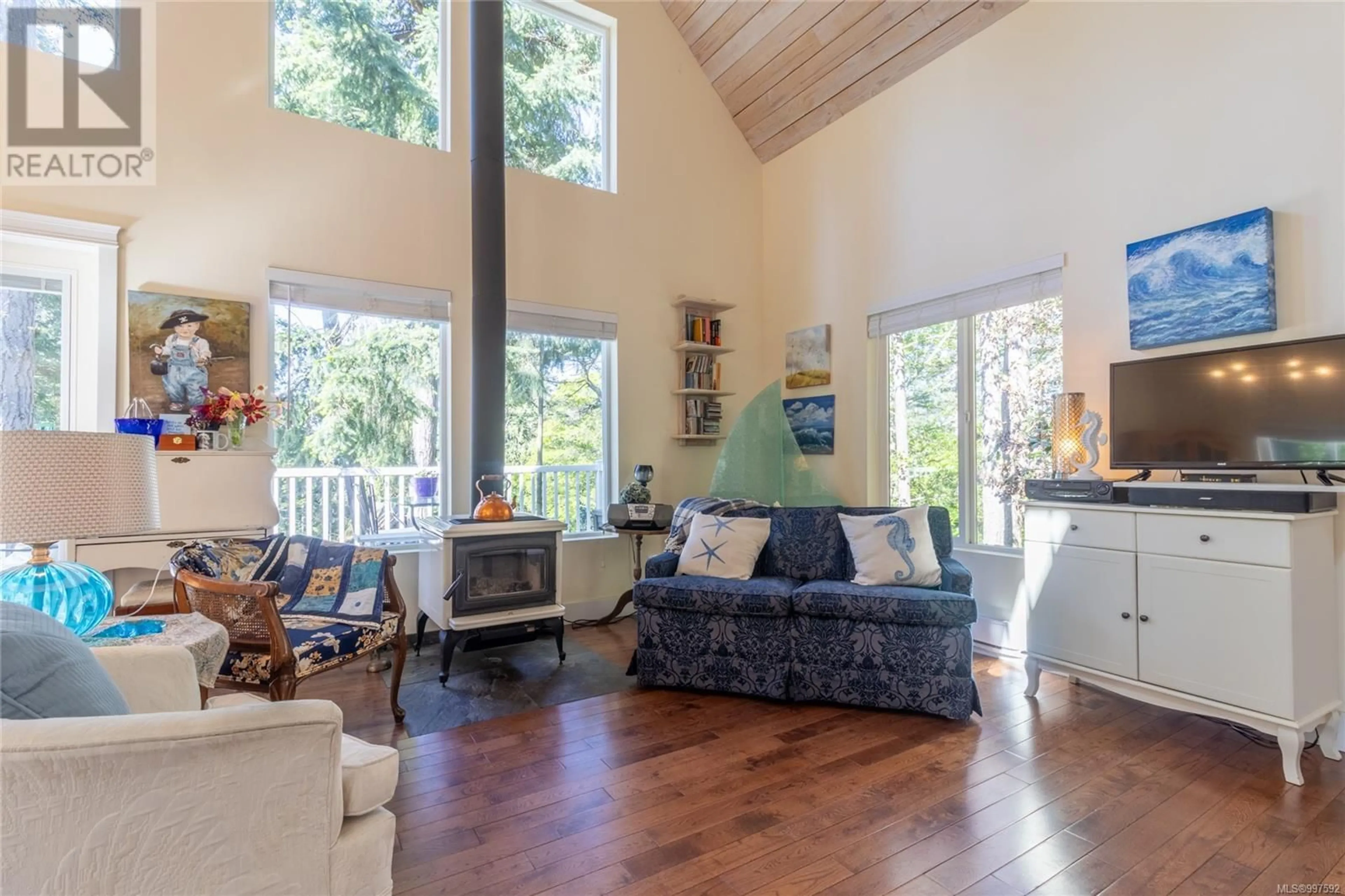 Living room with furniture, wood/laminate floor for 2643 SHOAL ROAD, Pender Island British Columbia V0N2M2