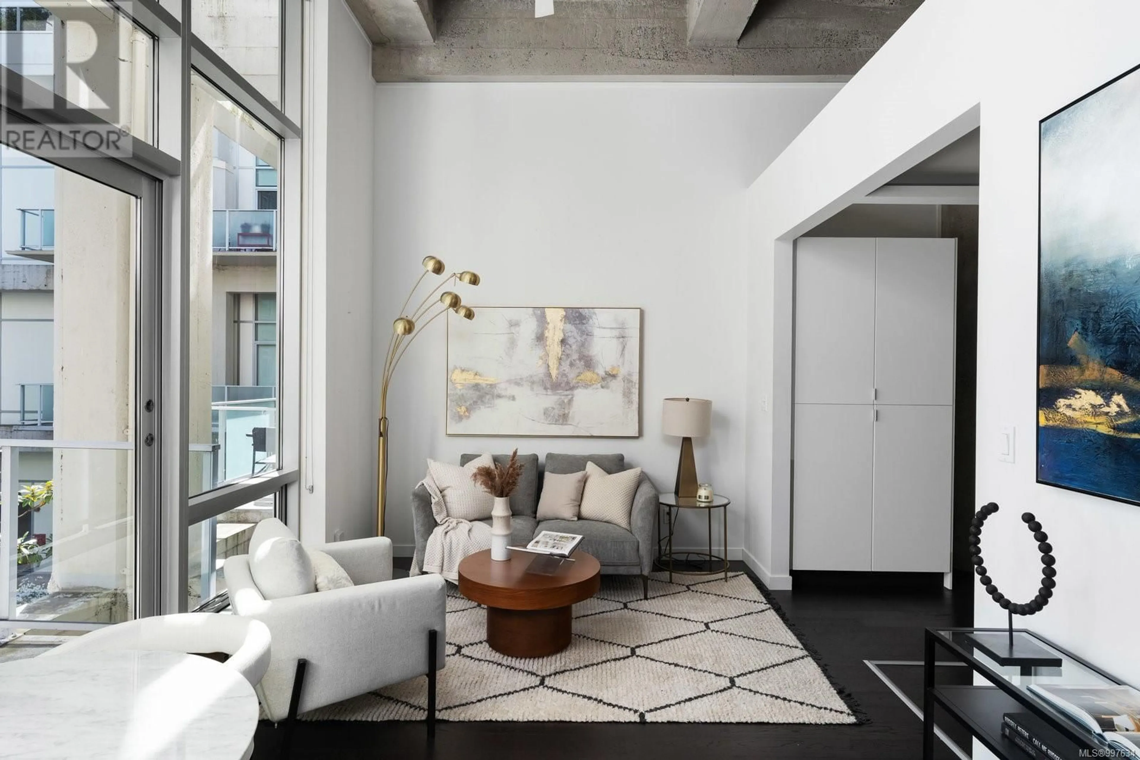 Living room with furniture, cement floor for 317 - 770 FISGARD STREET, Victoria British Columbia V8W0B8