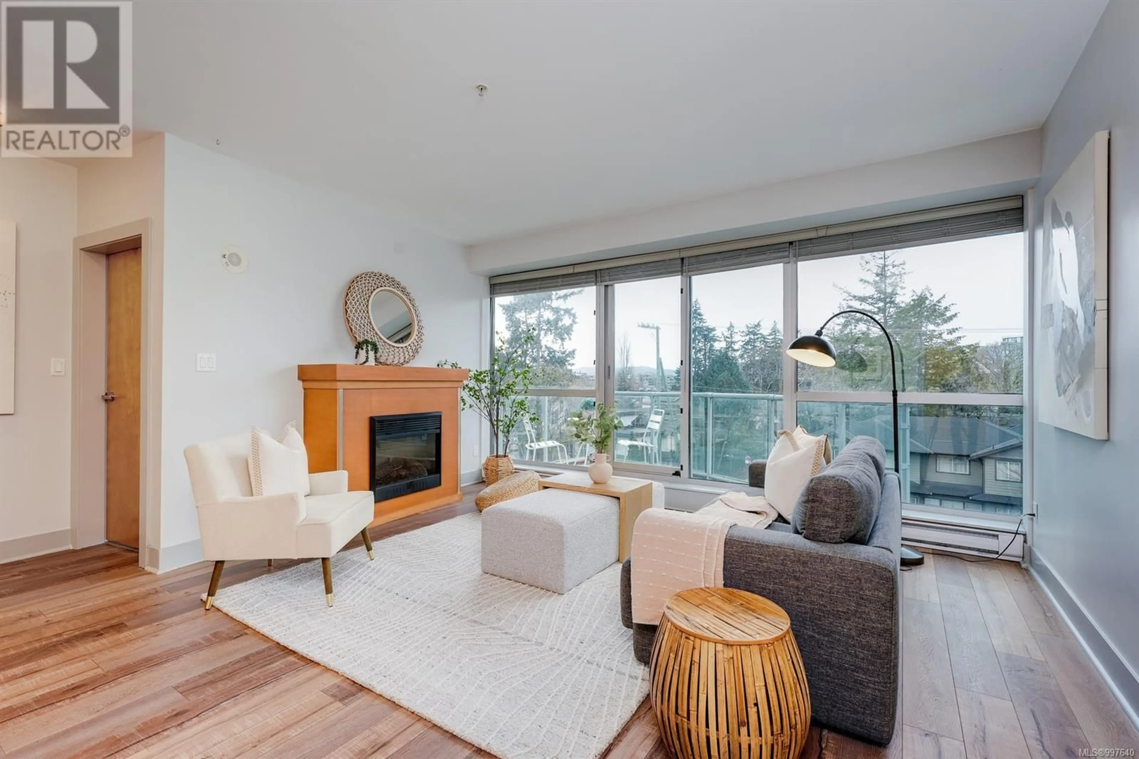 Living room with furniture, wood/laminate floor for 412 - 2745 VETERANS MEMORIAL PARKWAY, Langford British Columbia V9B0H4
