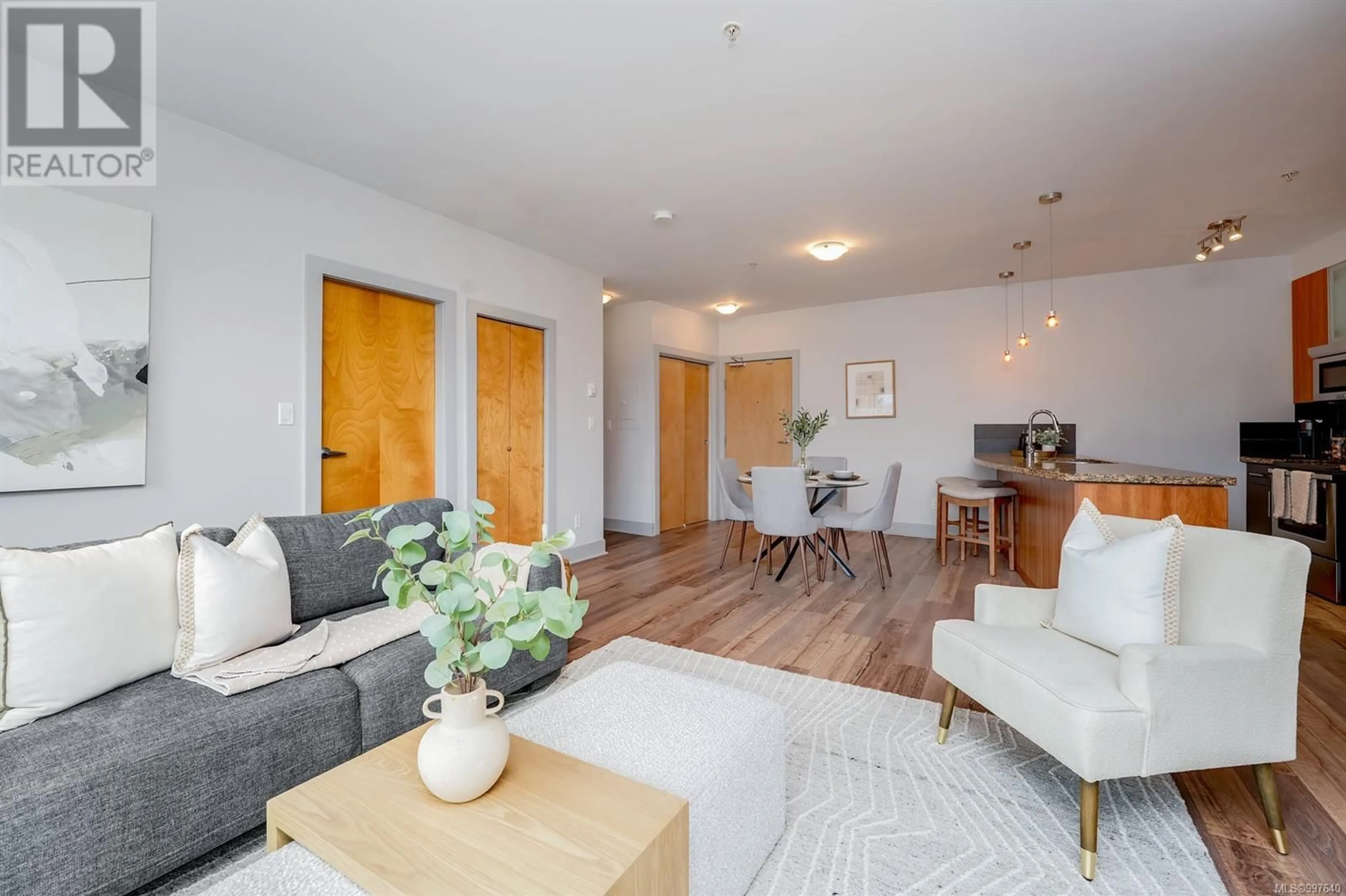Living room with furniture, wood/laminate floor for 412 - 2745 VETERANS MEMORIAL PARKWAY, Langford British Columbia V9B0H4