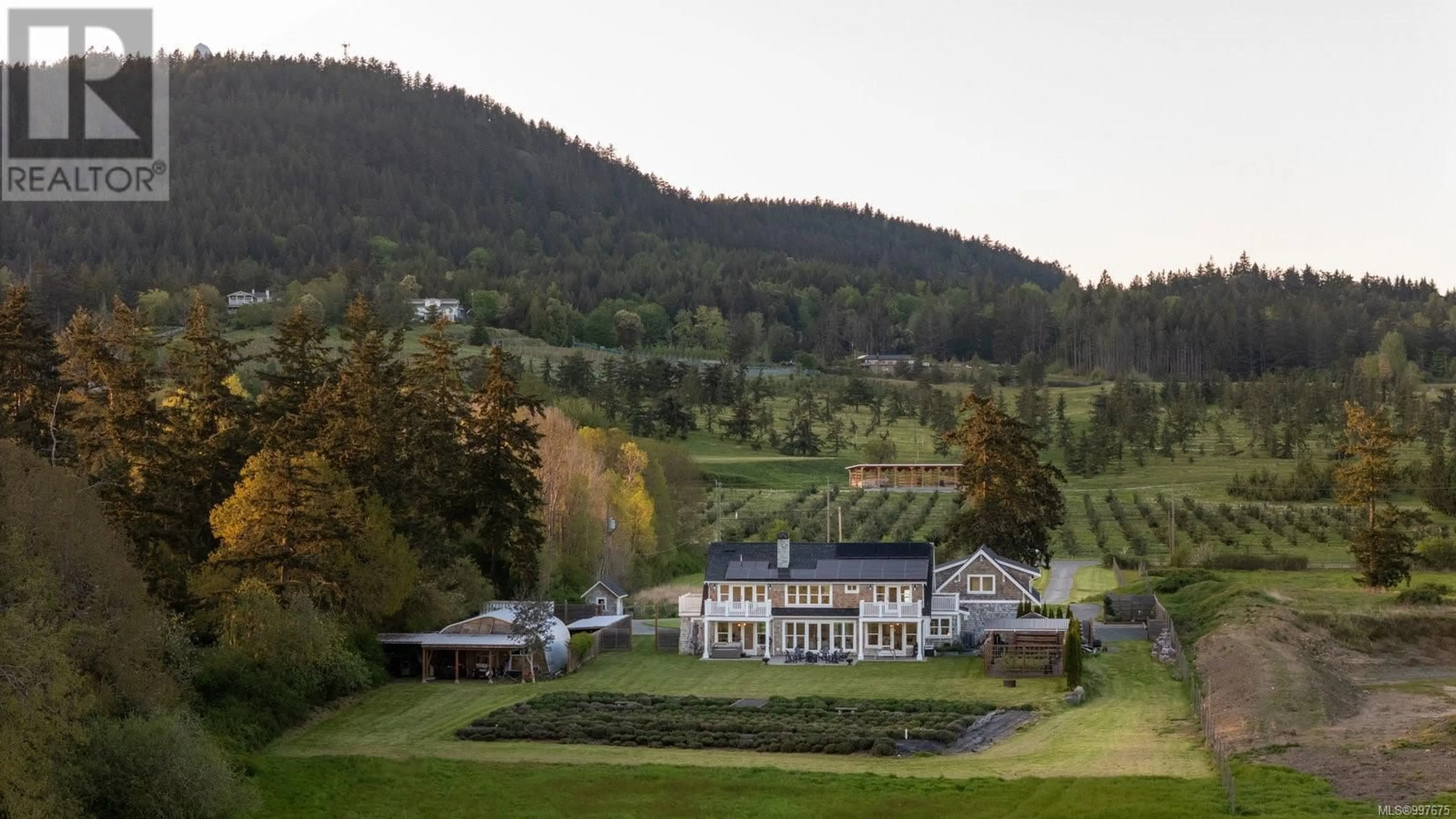 A pic from outside/outdoor area/front of a property/back of a property/a pic from drone, mountain view for 1527 MOUNT NEWTON CROSS ROAD, Central Saanich British Columbia V8M1L1