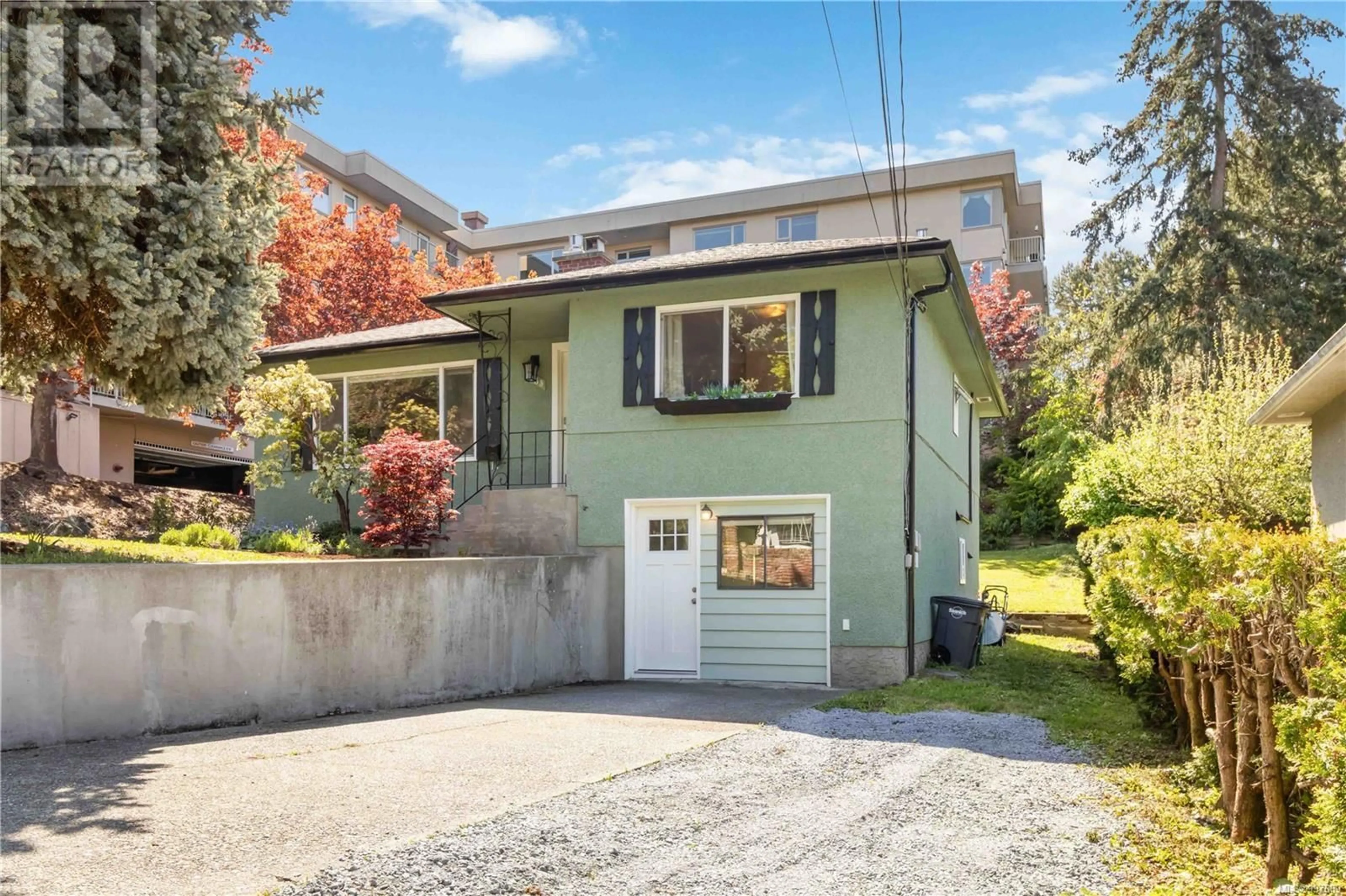 Home with vinyl exterior material, street for 1083 LODGE AVENUE, Saanich British Columbia V8X2B2