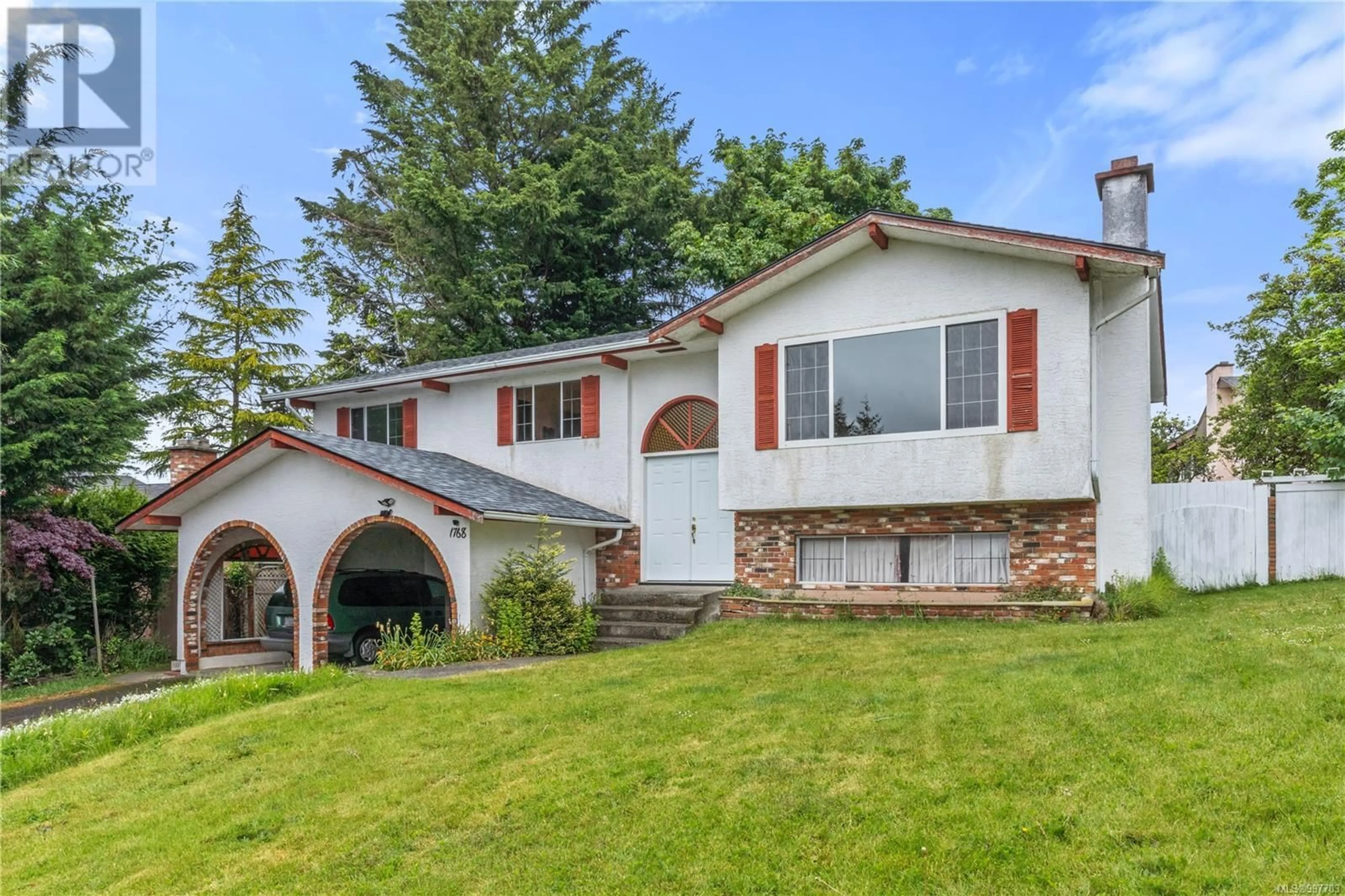 Home with vinyl exterior material, street for 1768 TRIEST CRESCENT, Saanich British Columbia V8N4W8