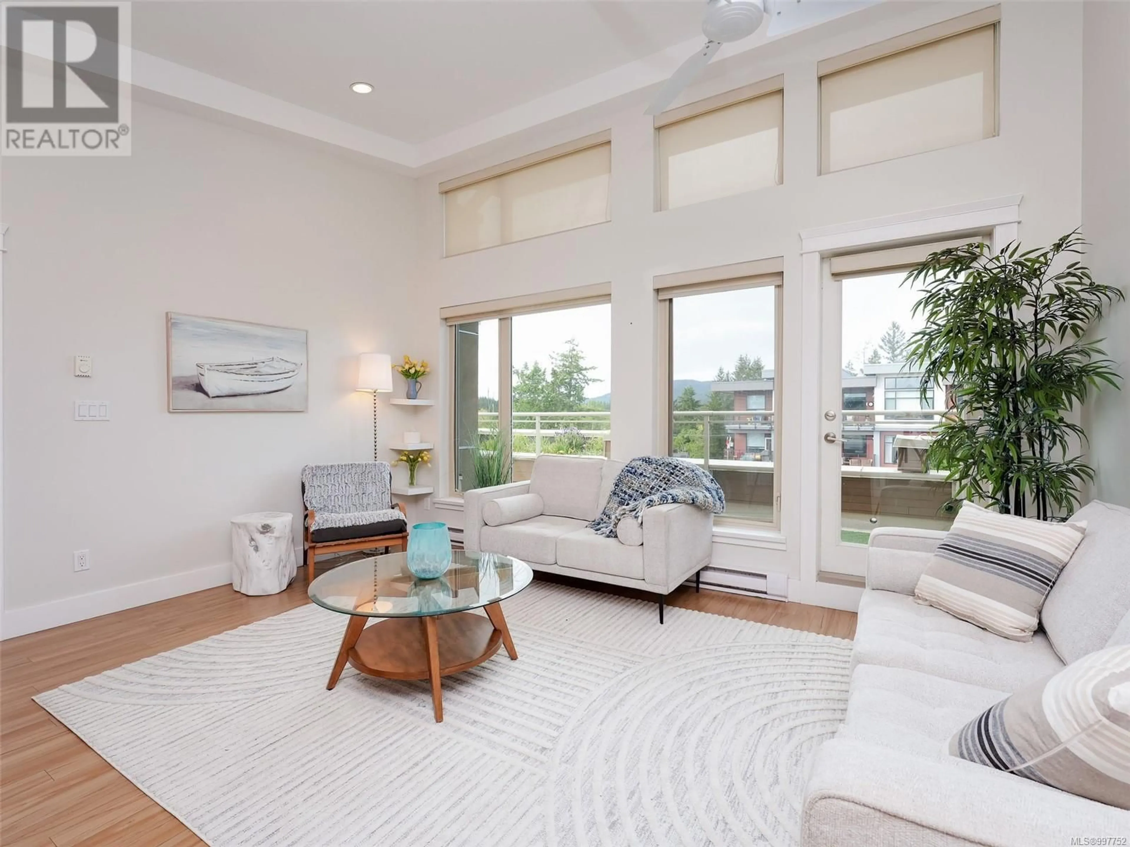 Living room with furniture, unknown for 403 - 7161 WEST SAANICH ROAD, Central Saanich British Columbia V8M1P7