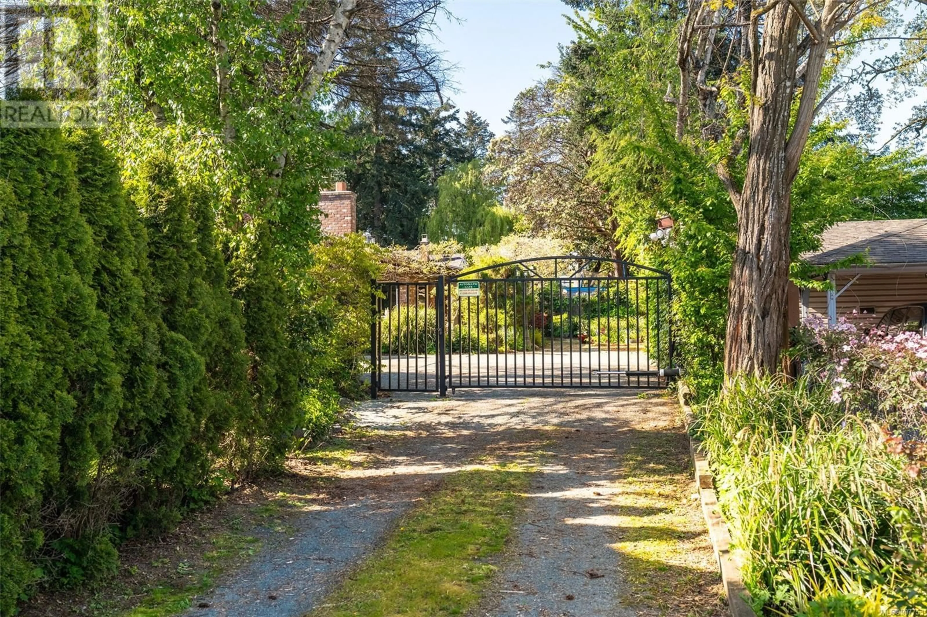 A pic from outside/outdoor area/front of a property/back of a property/a pic from drone, street for 1373 TREEBANK ROAD WEST, Esquimalt British Columbia V9A6Y7
