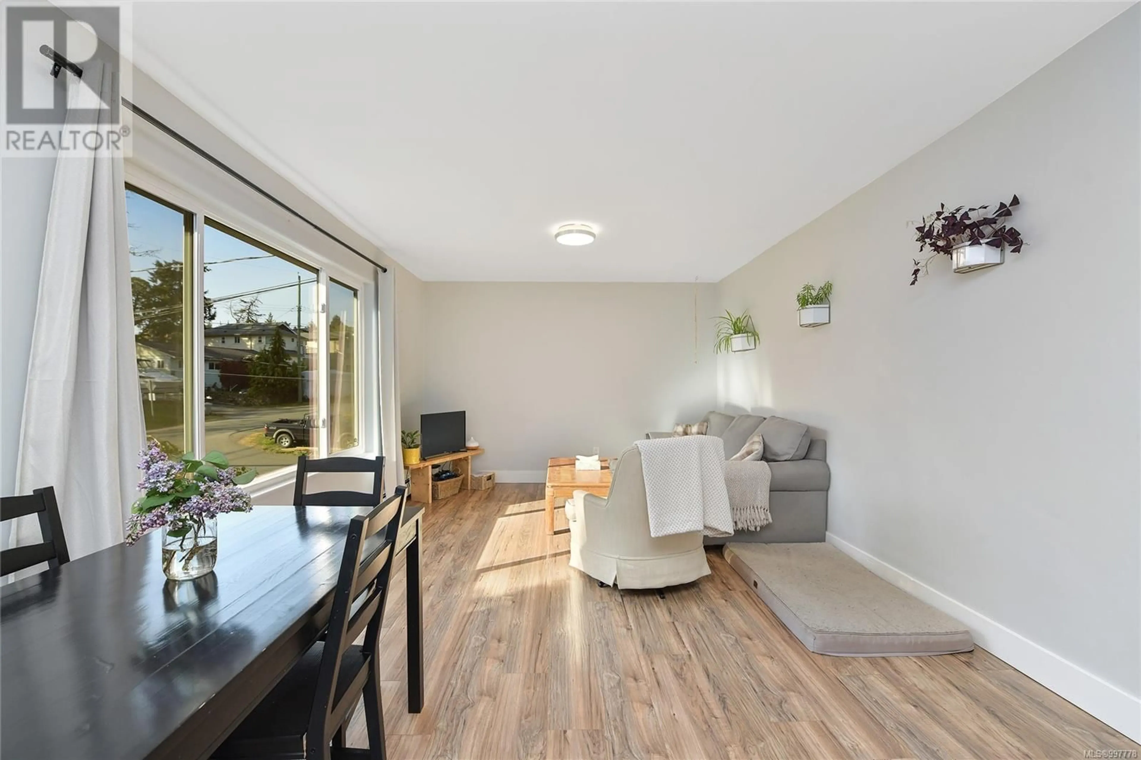 Living room with furniture, wood/laminate floor for 2589 WENTWICH ROAD, Langford British Columbia V9B3N5