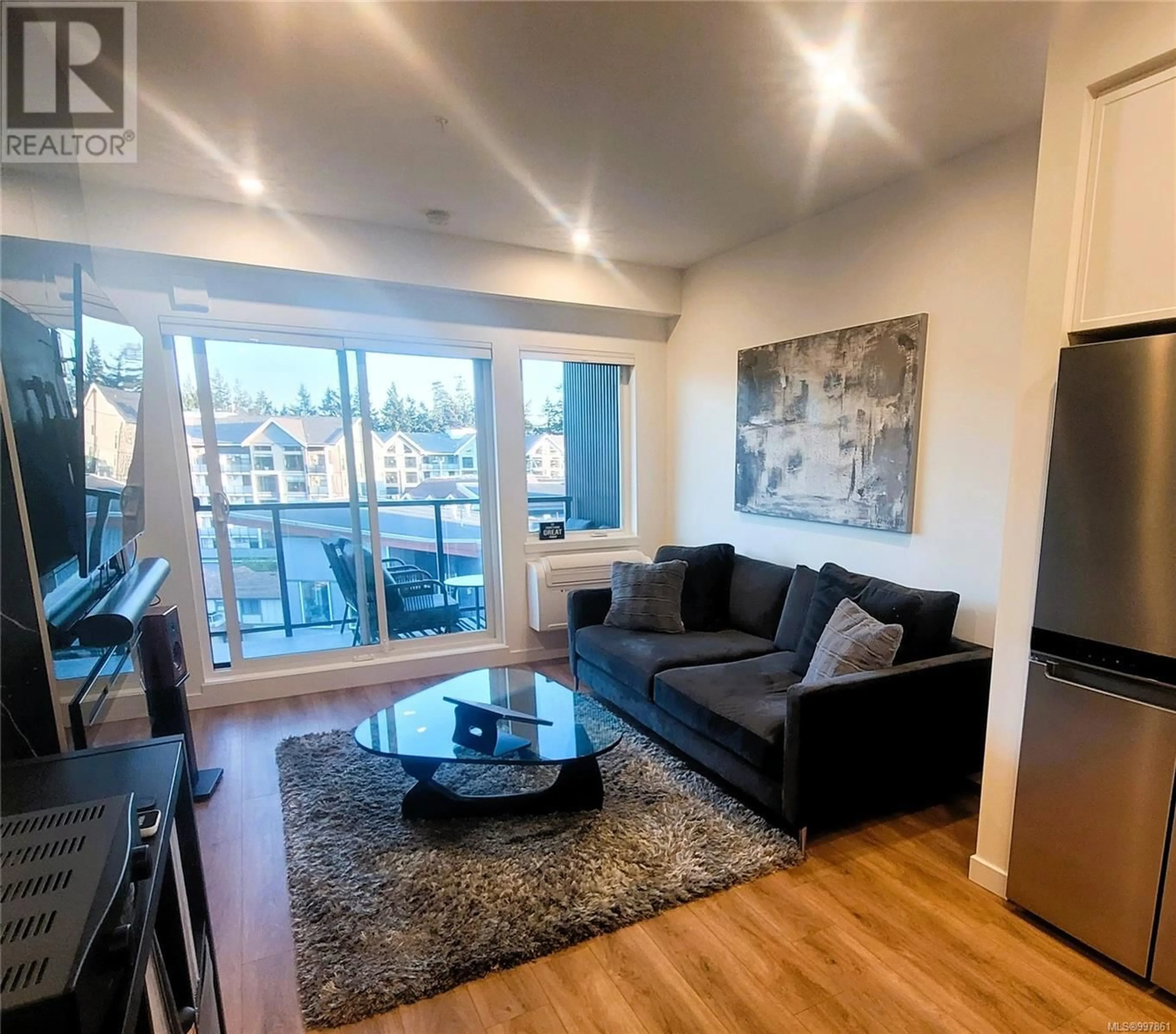 Living room with furniture, wood/laminate floor for 607 - 654 GRANDERSON ROAD, Langford British Columbia V9B7B9