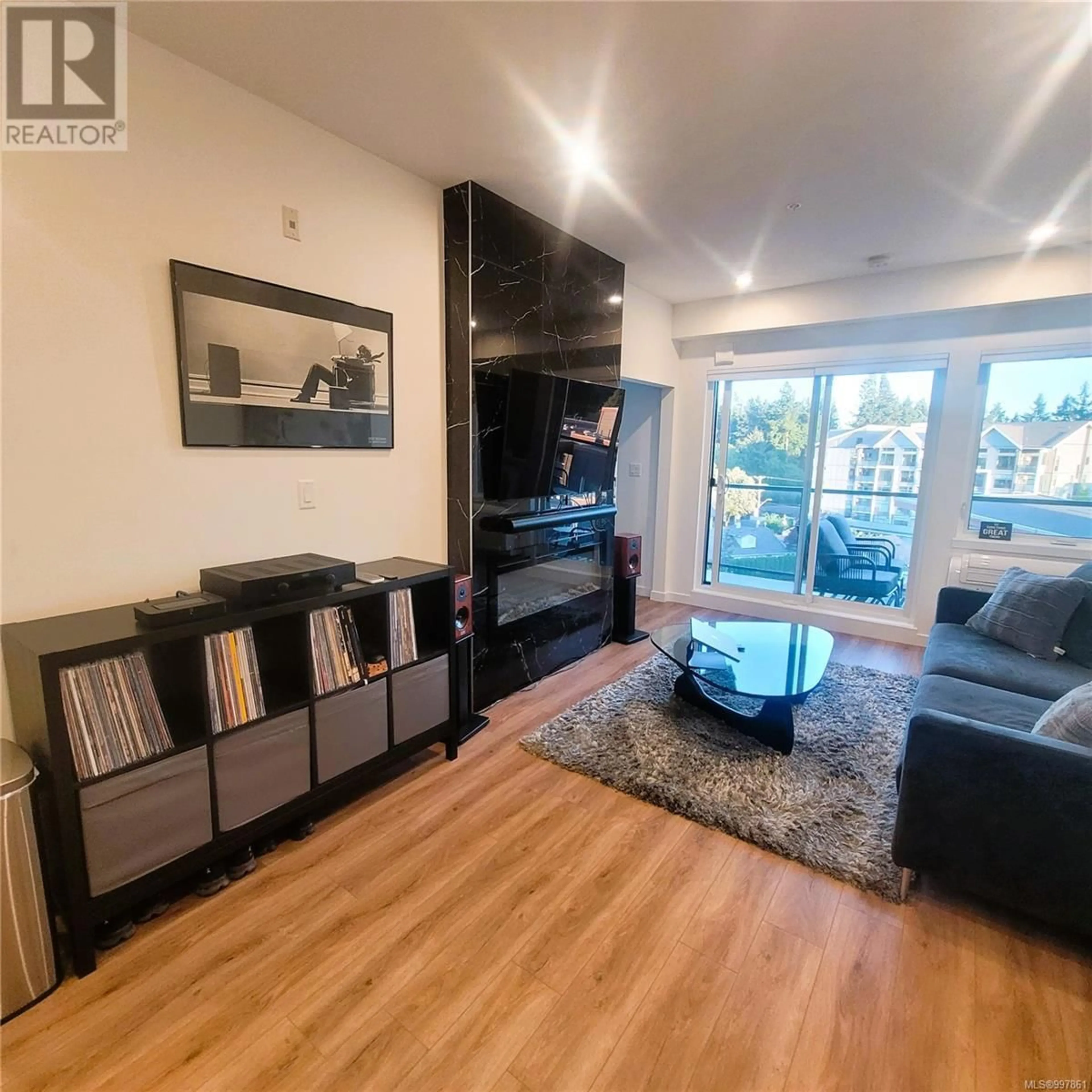 Living room with furniture, wood/laminate floor for 607 - 654 GRANDERSON ROAD, Langford British Columbia V9B7B9