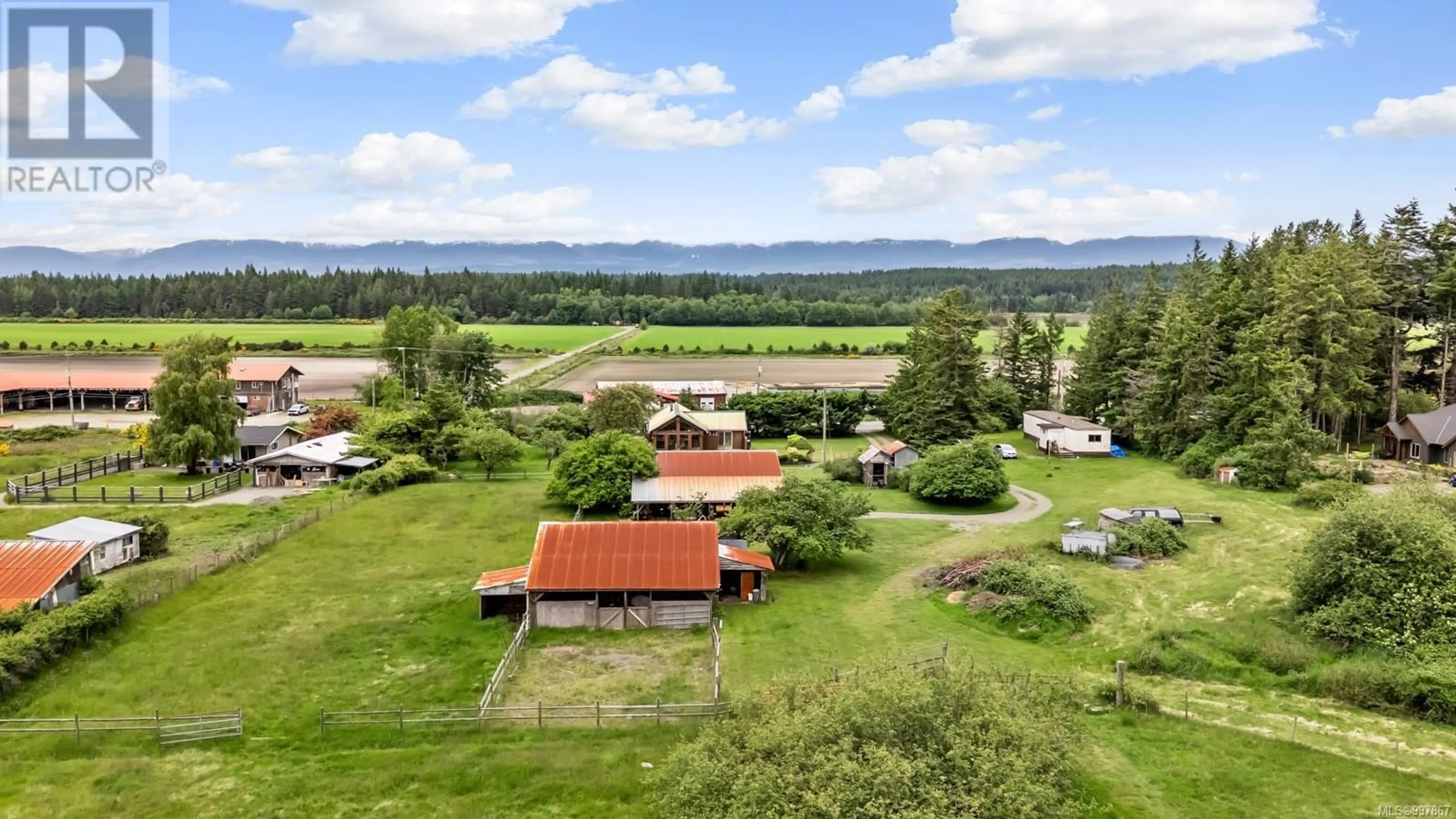 A pic from outside/outdoor area/front of a property/back of a property/a pic from drone, mountain view for 818 KNIGHT ROAD, Comox British Columbia V9M3T2