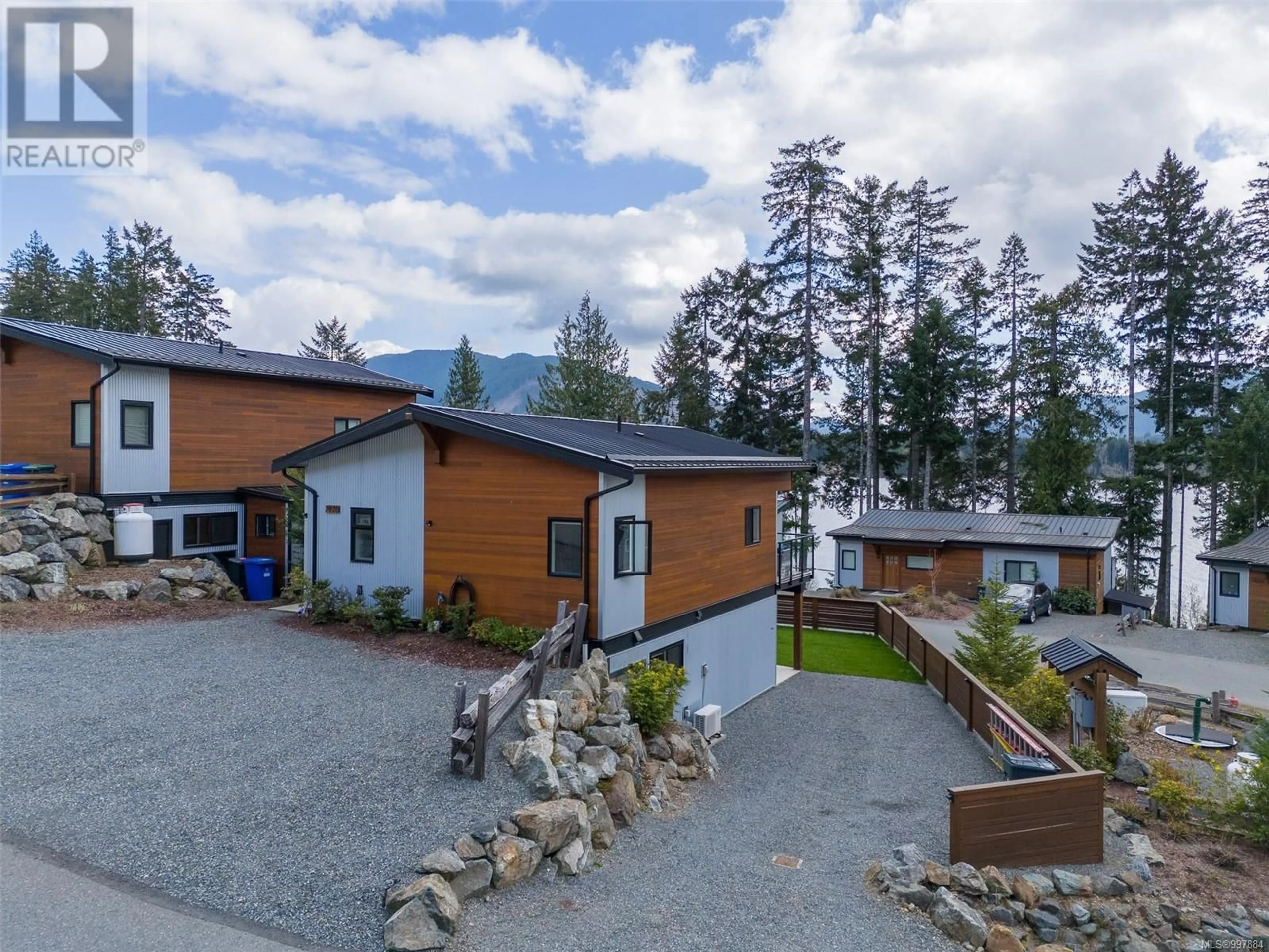 A pic from outside/outdoor area/front of a property/back of a property/a pic from drone, mountain view for 7420 COTTAGE WAY, Lake Cowichan British Columbia V0R2G1