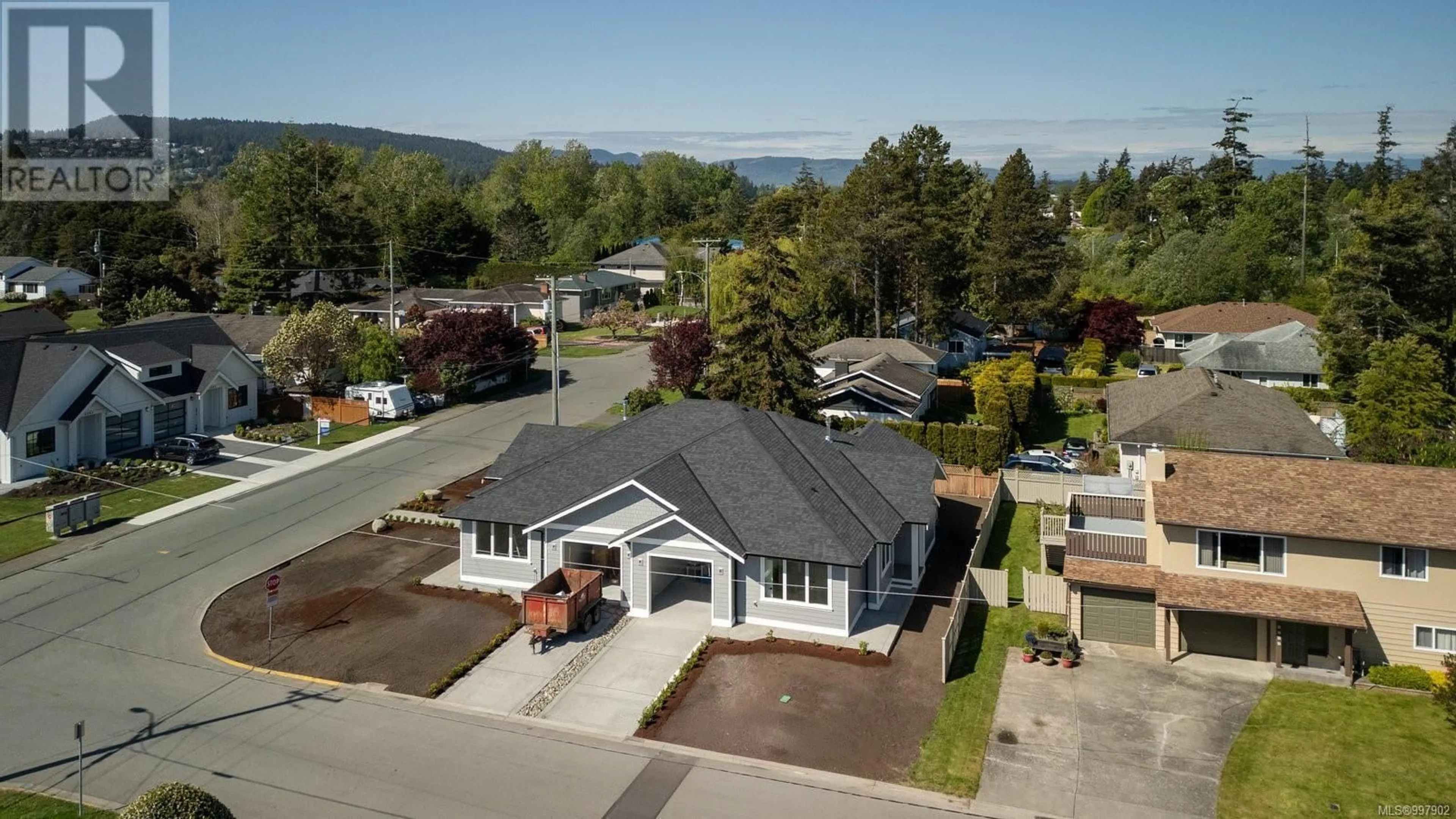 A pic from outside/outdoor area/front of a property/back of a property/a pic from drone, mountain view for 9556 NORTHLAWN TERRACE, Sidney British Columbia V8L1R8