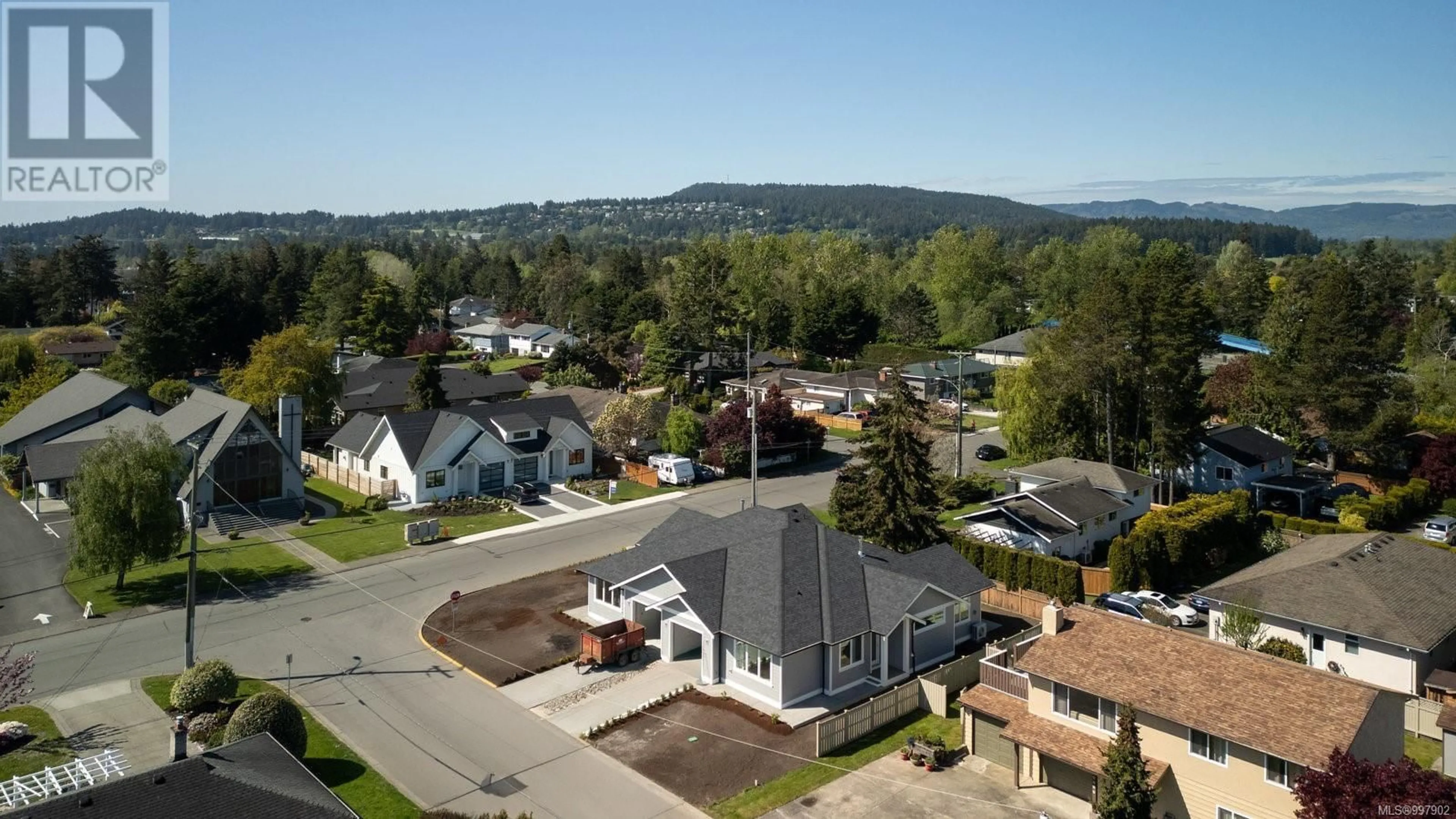 A pic from outside/outdoor area/front of a property/back of a property/a pic from drone, mountain view for 9556 NORTHLAWN TERRACE, Sidney British Columbia V8L1R8