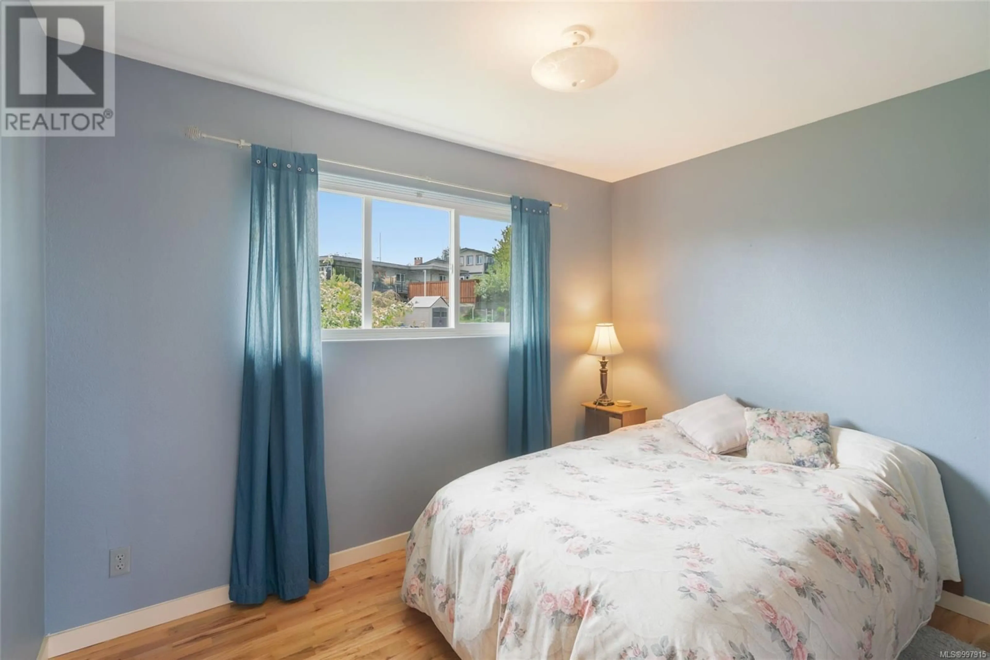 Bedroom with bed, wood/laminate floor for 631 HAWKINS STREET, Nanaimo British Columbia V9S2V5