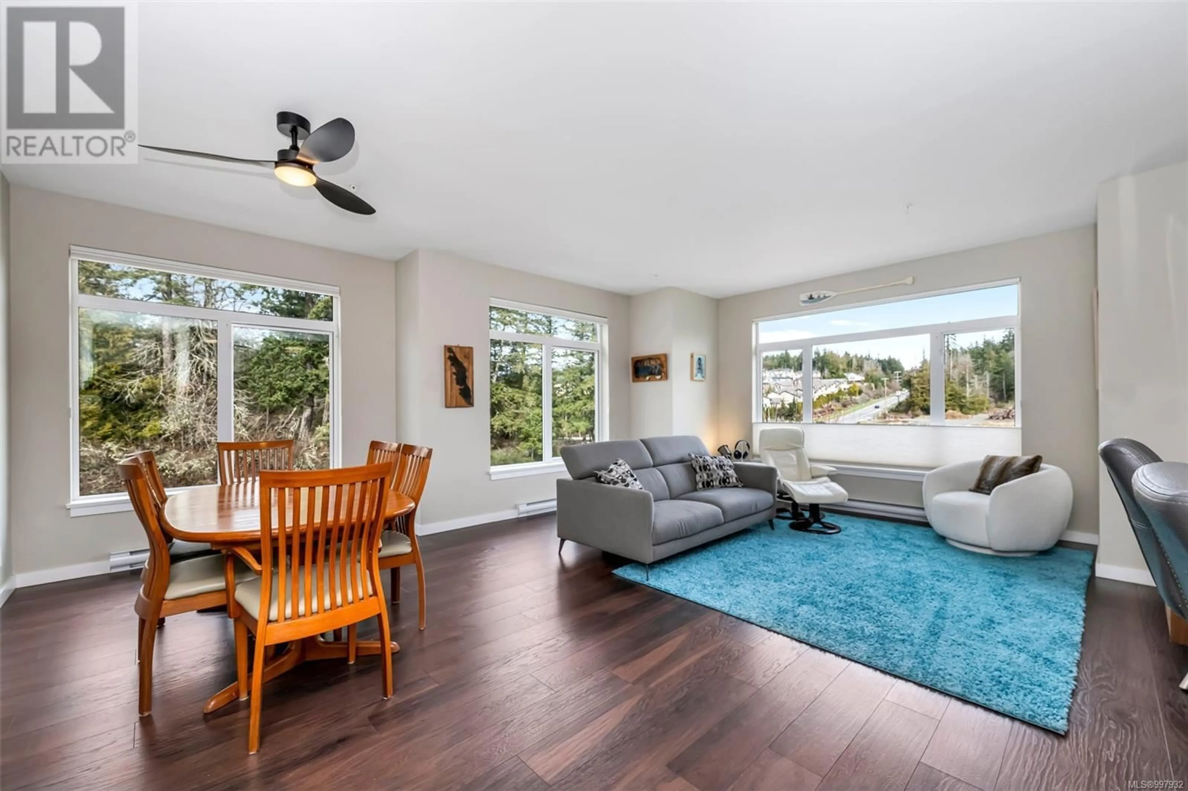 Living room with furniture, wood/laminate floor for 300 - 591 LATORIA ROAD, Colwood British Columbia V9C2Z9