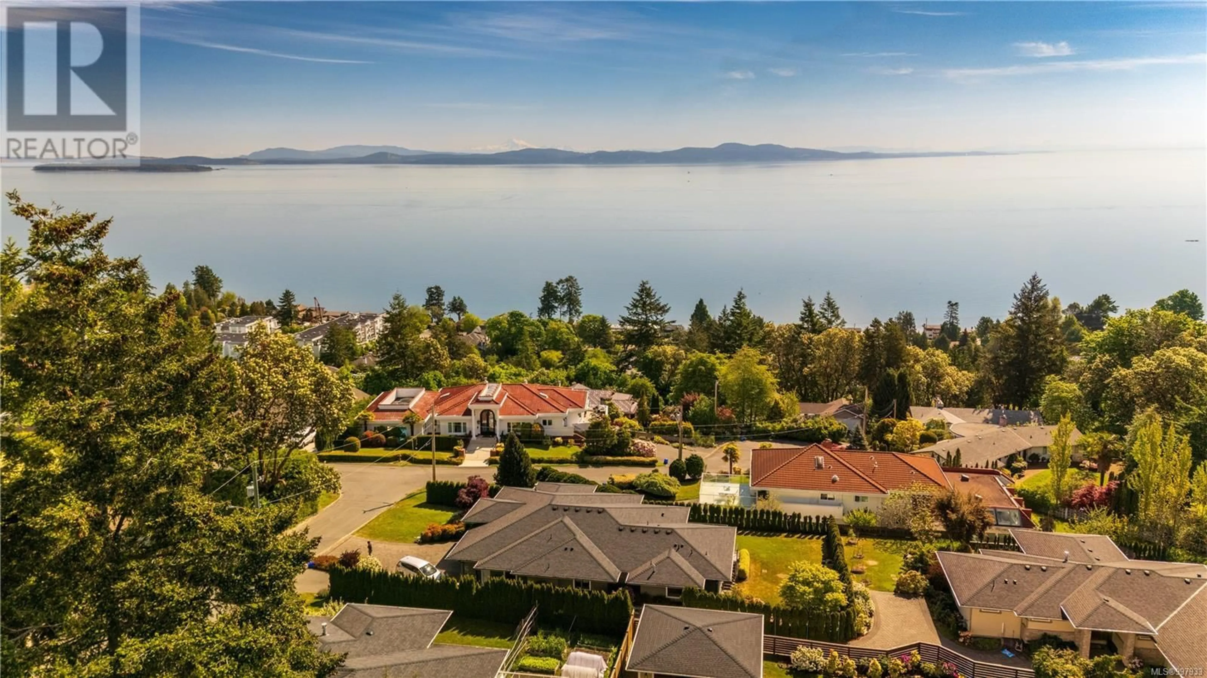 A pic from outside/outdoor area/front of a property/back of a property/a pic from drone, water/lake/river/ocean view for 5058 WESLEY ROAD, Saanich British Columbia V8Y1Z4