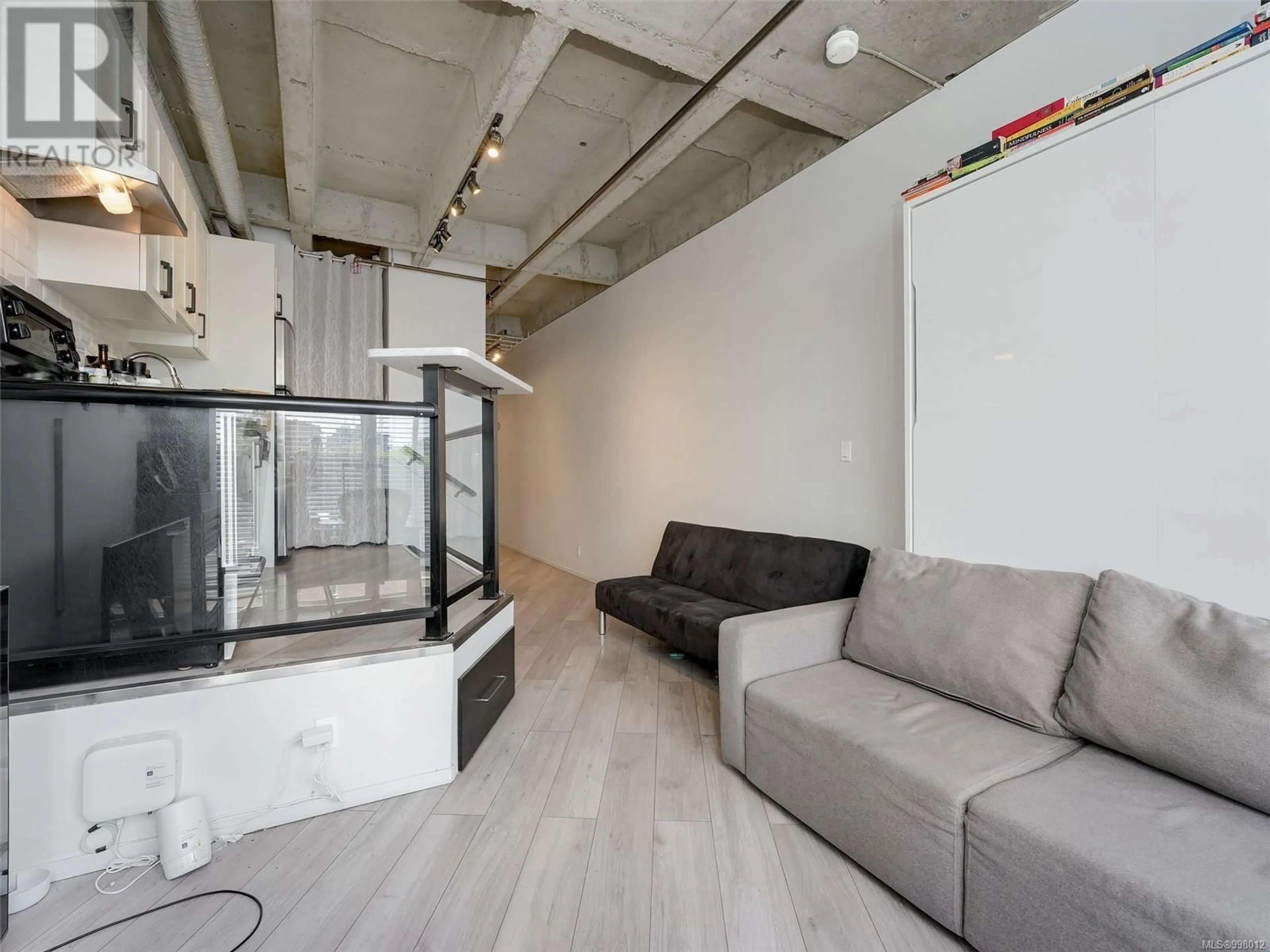 Living room with furniture, cement floor for 417 - 1061 FORT STREET, Victoria British Columbia V8V5A1
