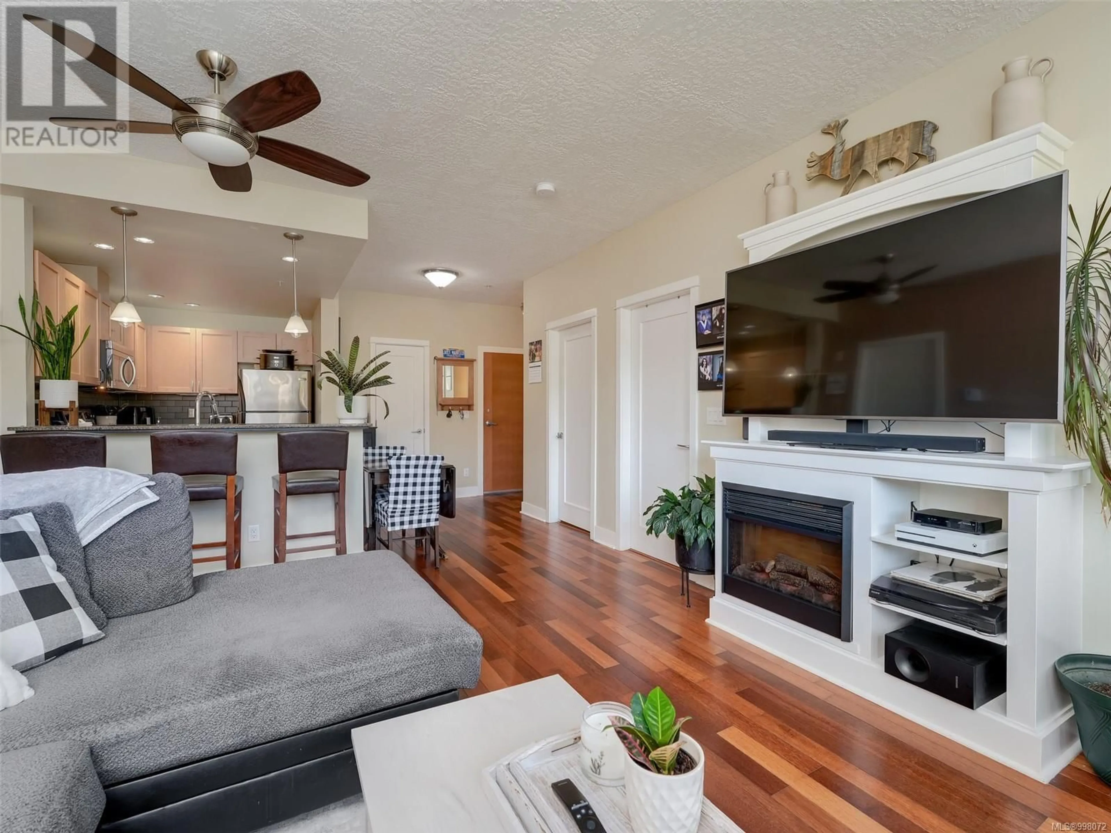Living room with furniture, wood/laminate floor for 203 - 627 BROOKSIDE ROAD, Colwood British Columbia V8Y2S2