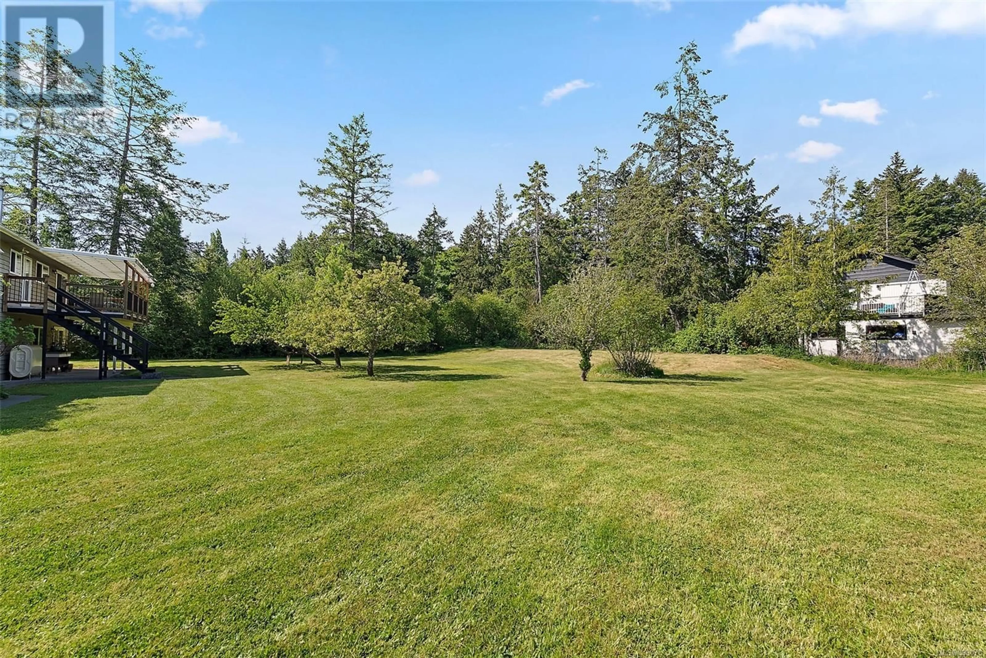 A pic from outside/outdoor area/front of a property/back of a property/a pic from drone, forest/trees view for 10814 DERRICK ROAD, North Saanich British Columbia V8L5M5
