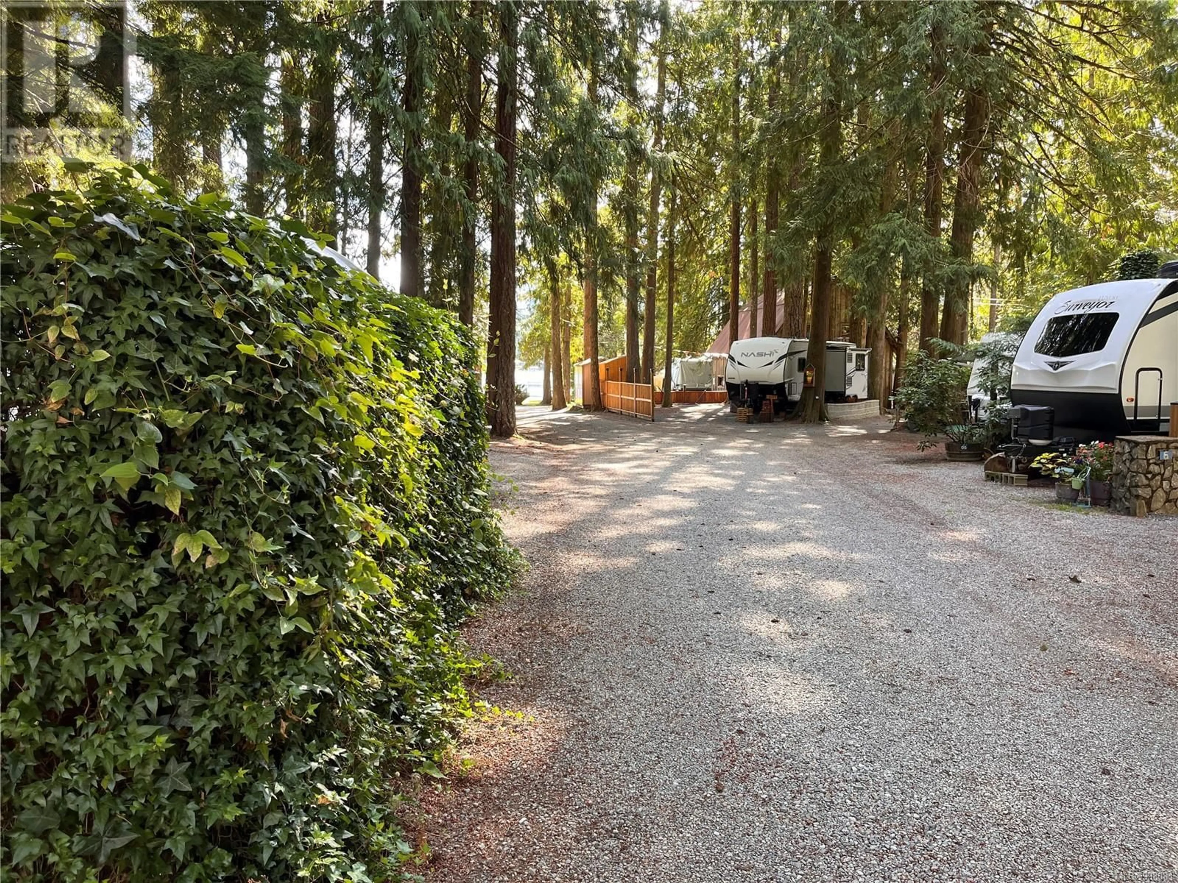A pic from outside/outdoor area/front of a property/back of a property/a pic from drone, forest/trees view for B9 - 10324 LAKESHORE ROAD, Port Alberni British Columbia V9Y8Z6