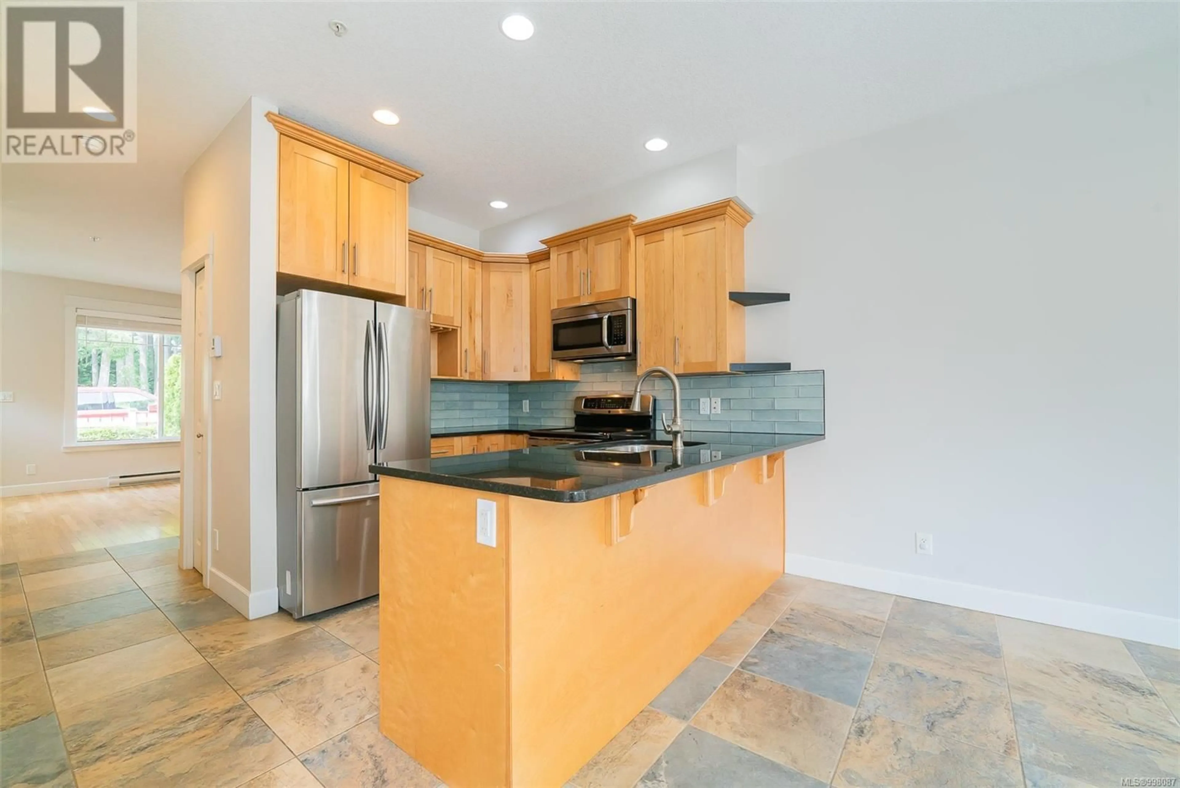 Standard kitchen, ceramic/tile floor for 105 - 6057 DOUMONT ROAD, Nanaimo British Columbia V9T0G3