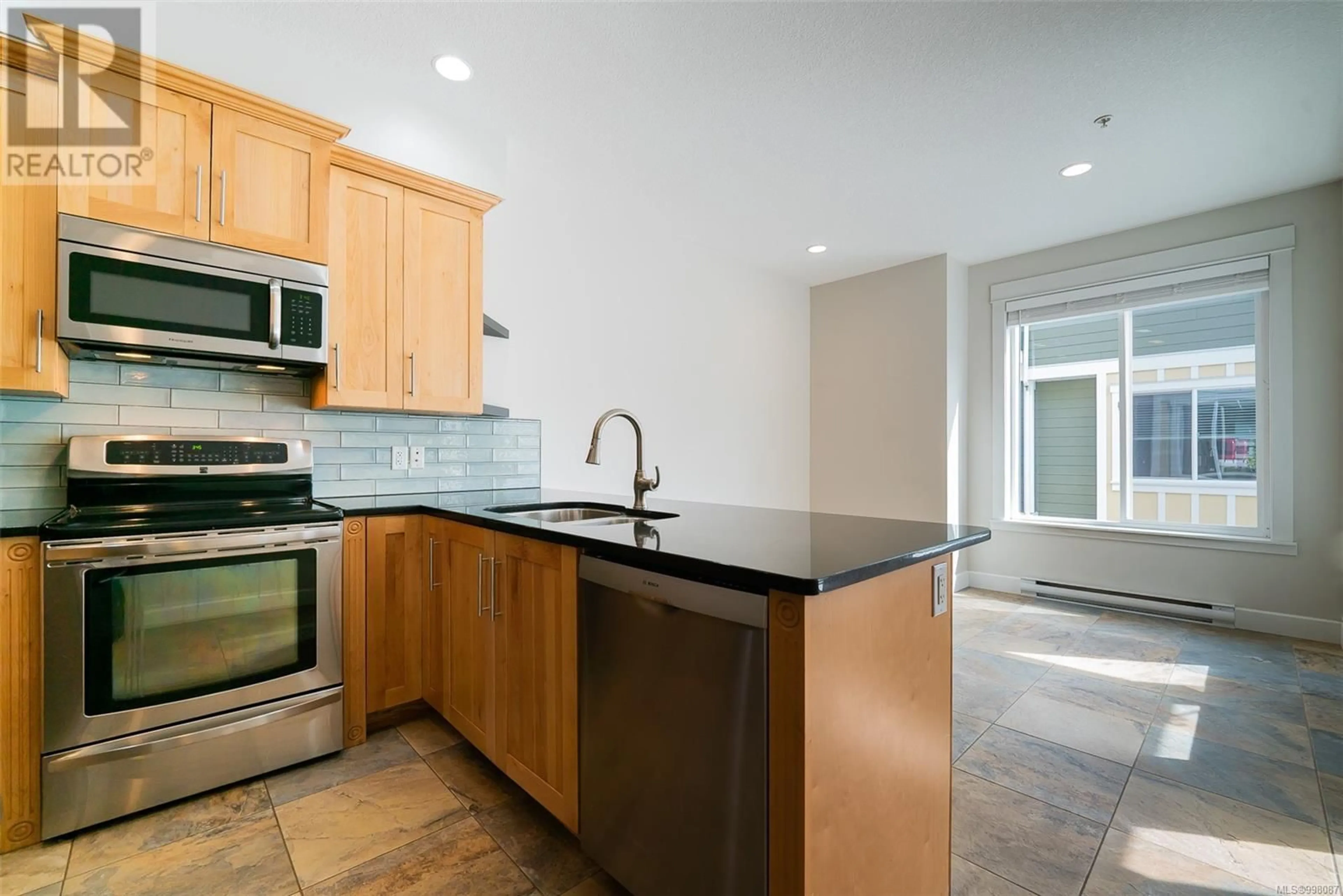 Standard kitchen, ceramic/tile floor for 105 - 6057 DOUMONT ROAD, Nanaimo British Columbia V9T0G3