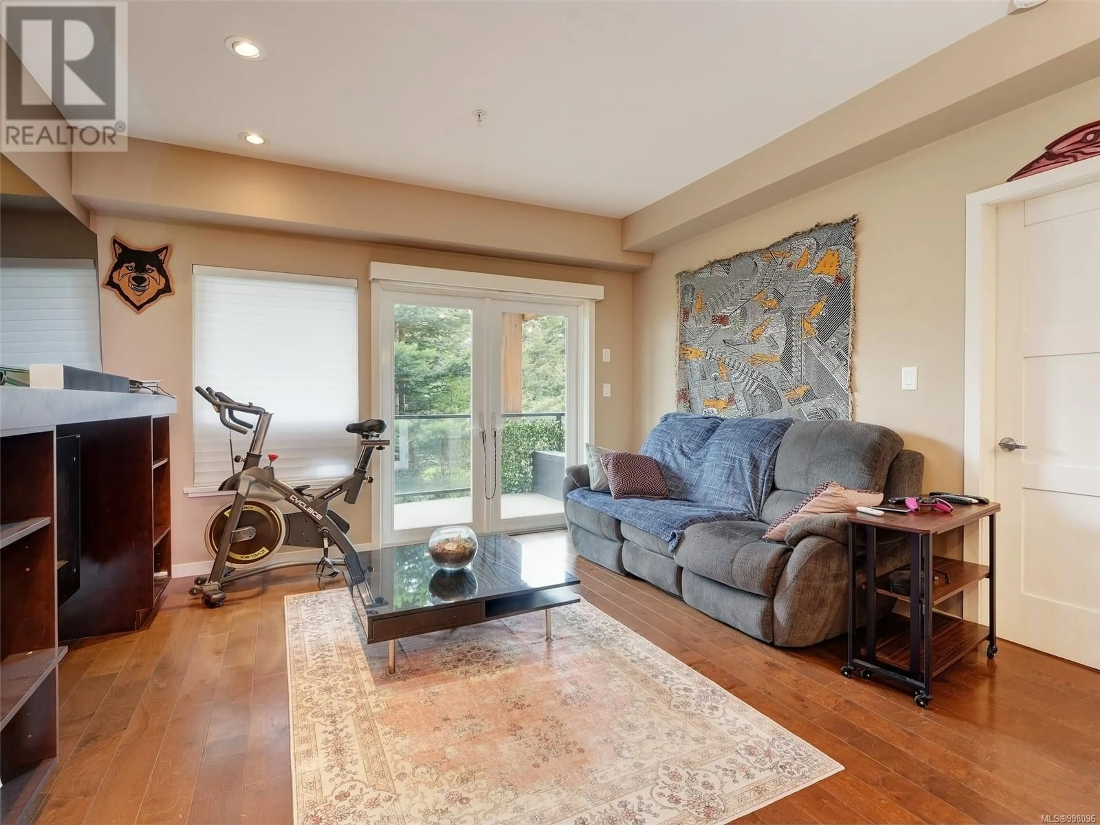 Living room with furniture, wood/laminate floor for 305 - 6591 LINCROFT ROAD, Sooke British Columbia V9Z1M2