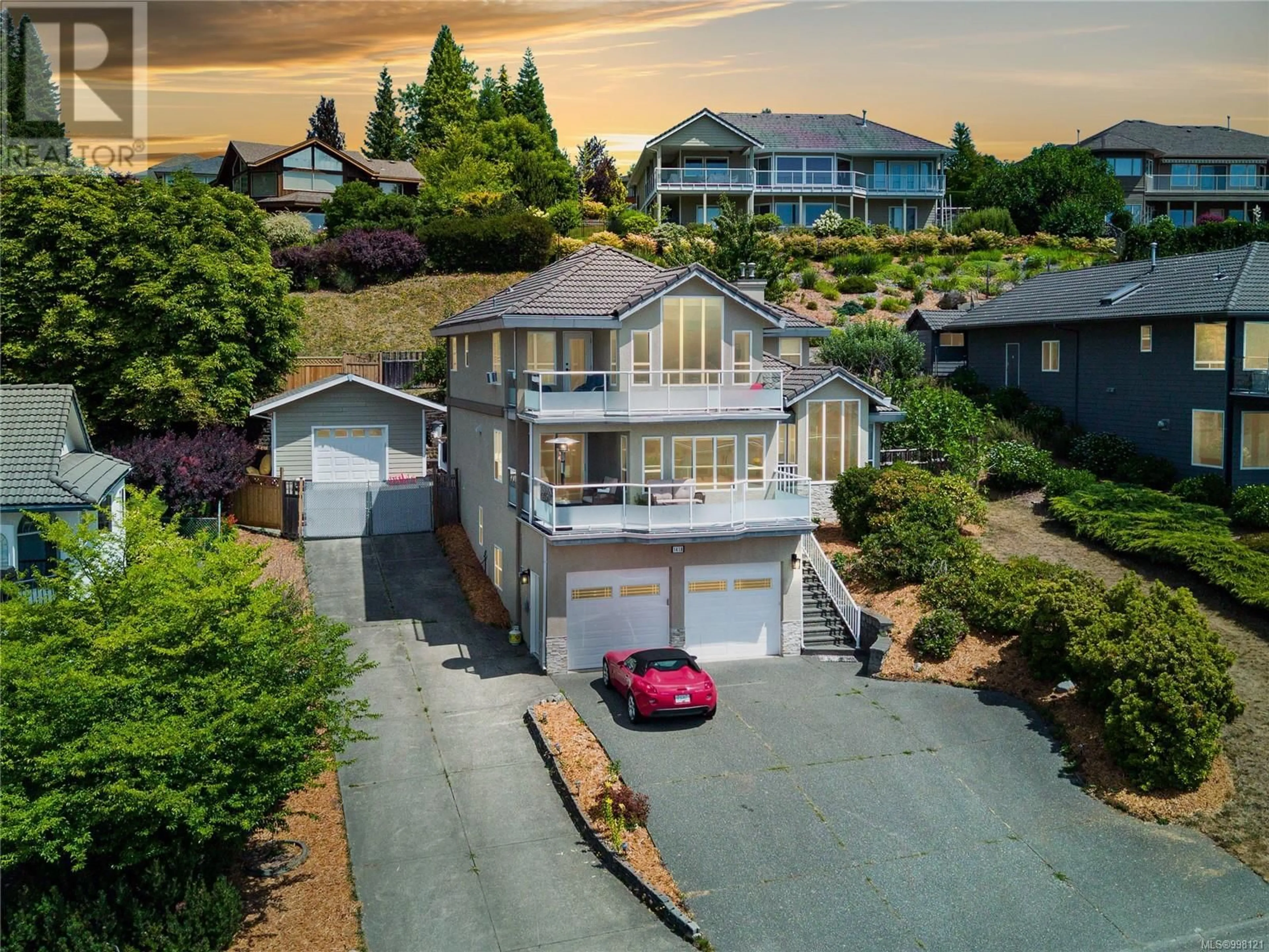 A pic from outside/outdoor area/front of a property/back of a property/a pic from drone, water/lake/river/ocean view for 1418 VALLEY VIEW DRIVE, Courtenay British Columbia V9N8T3