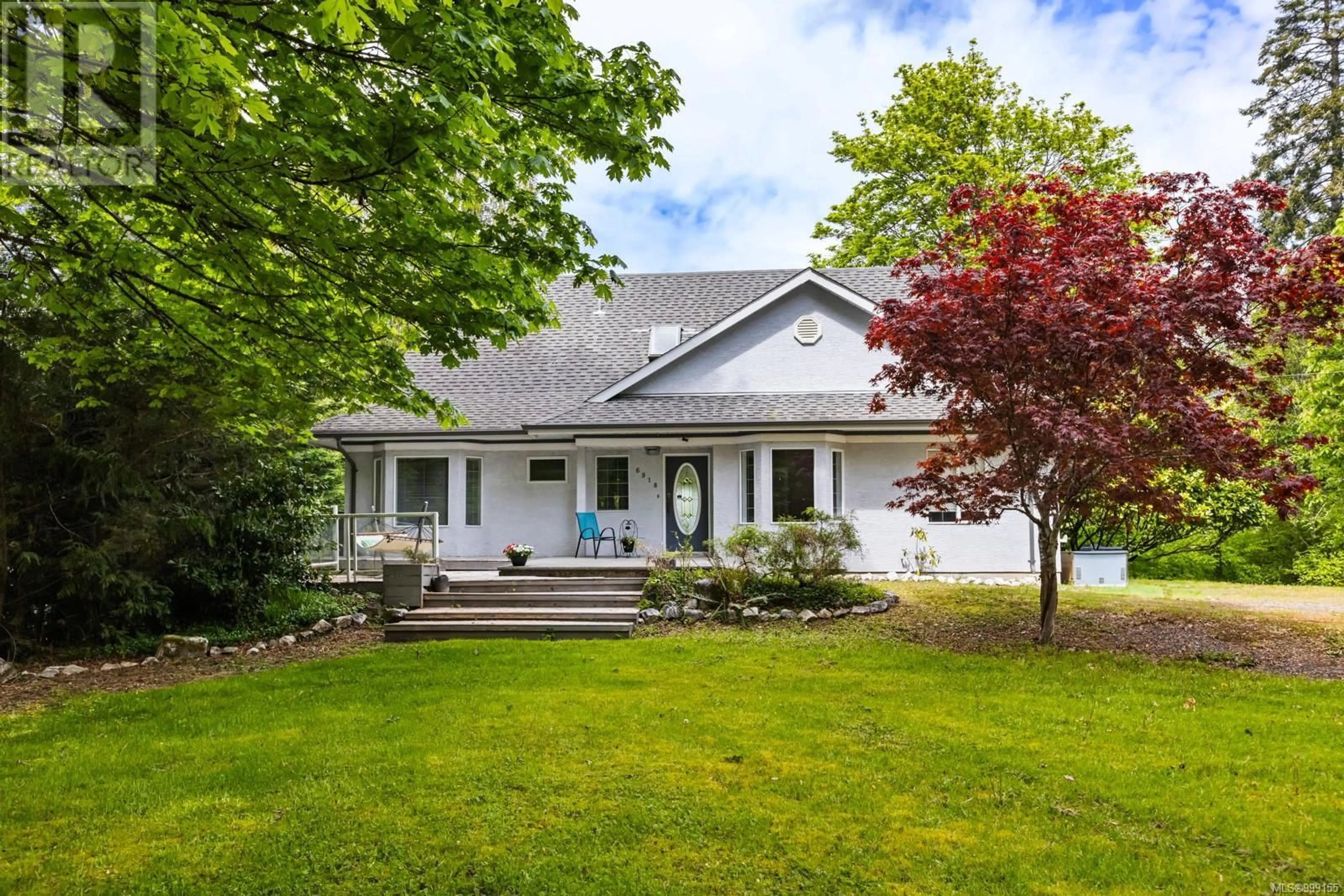 Home with vinyl exterior material, street for 6918 BEACH DRIVE, Honeymoon Bay British Columbia V0R1Y0