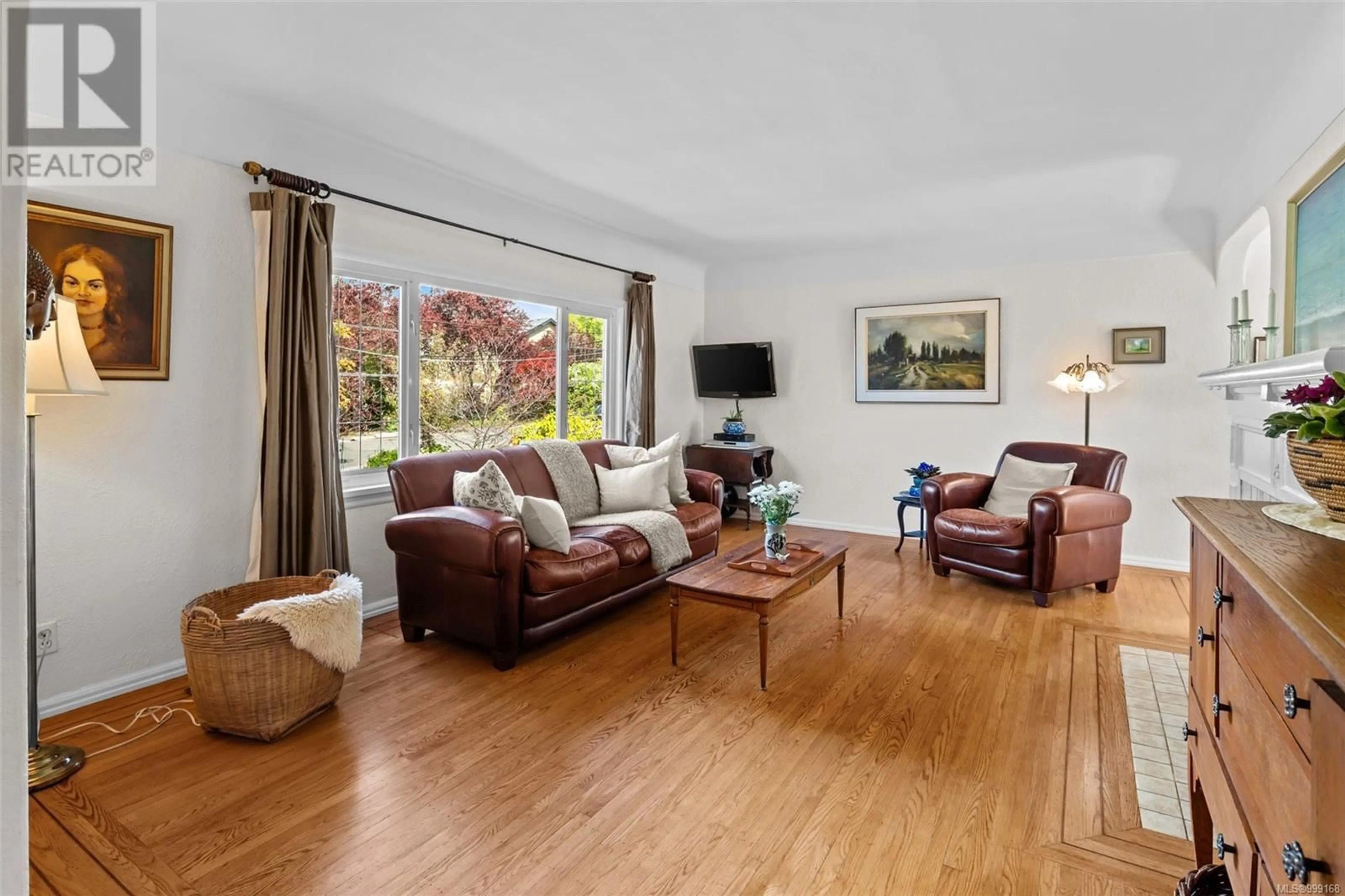 Living room with furniture, wood/laminate floor for 1757 ARMSTRONG AVENUE, Oak Bay British Columbia V8R5S5