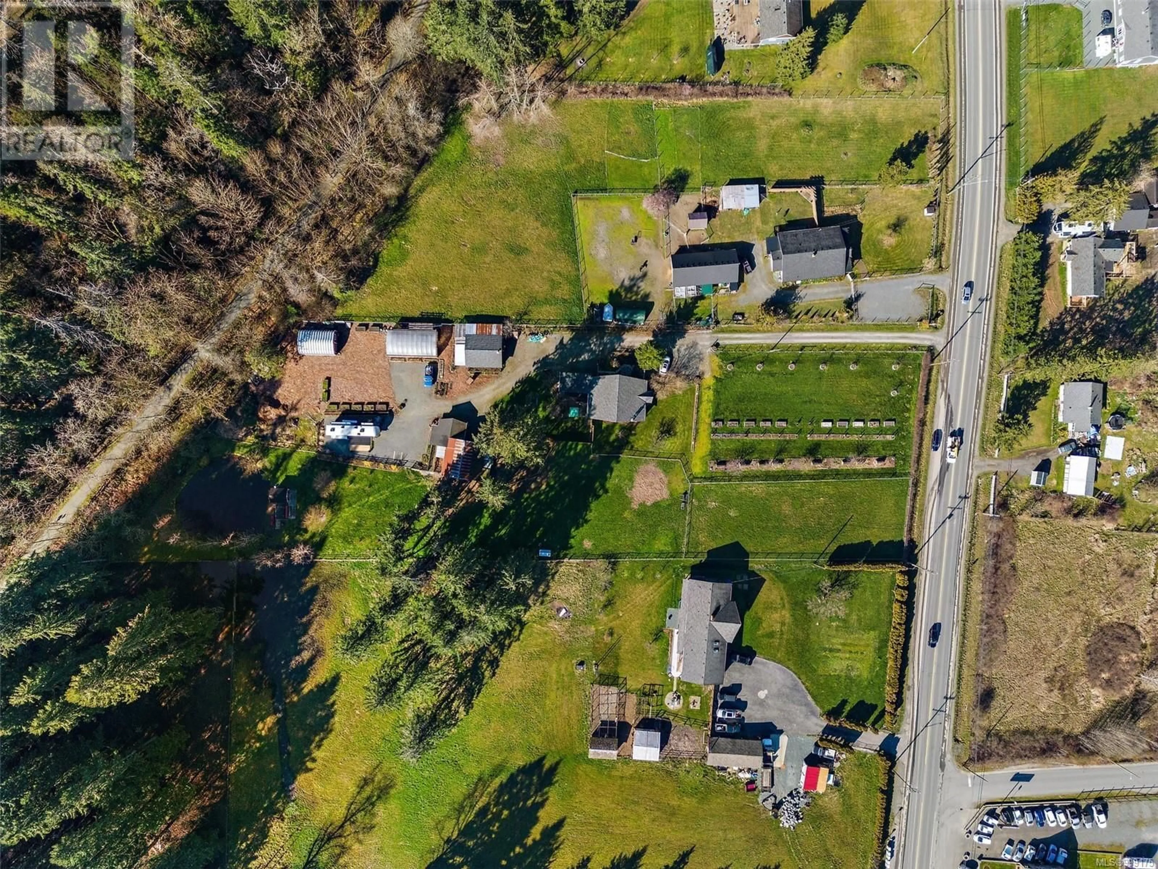 A pic from outside/outdoor area/front of a property/back of a property/a pic from drone, street for 3574 COWICHAN LAKE ROAD, Duncan British Columbia V9L6K5