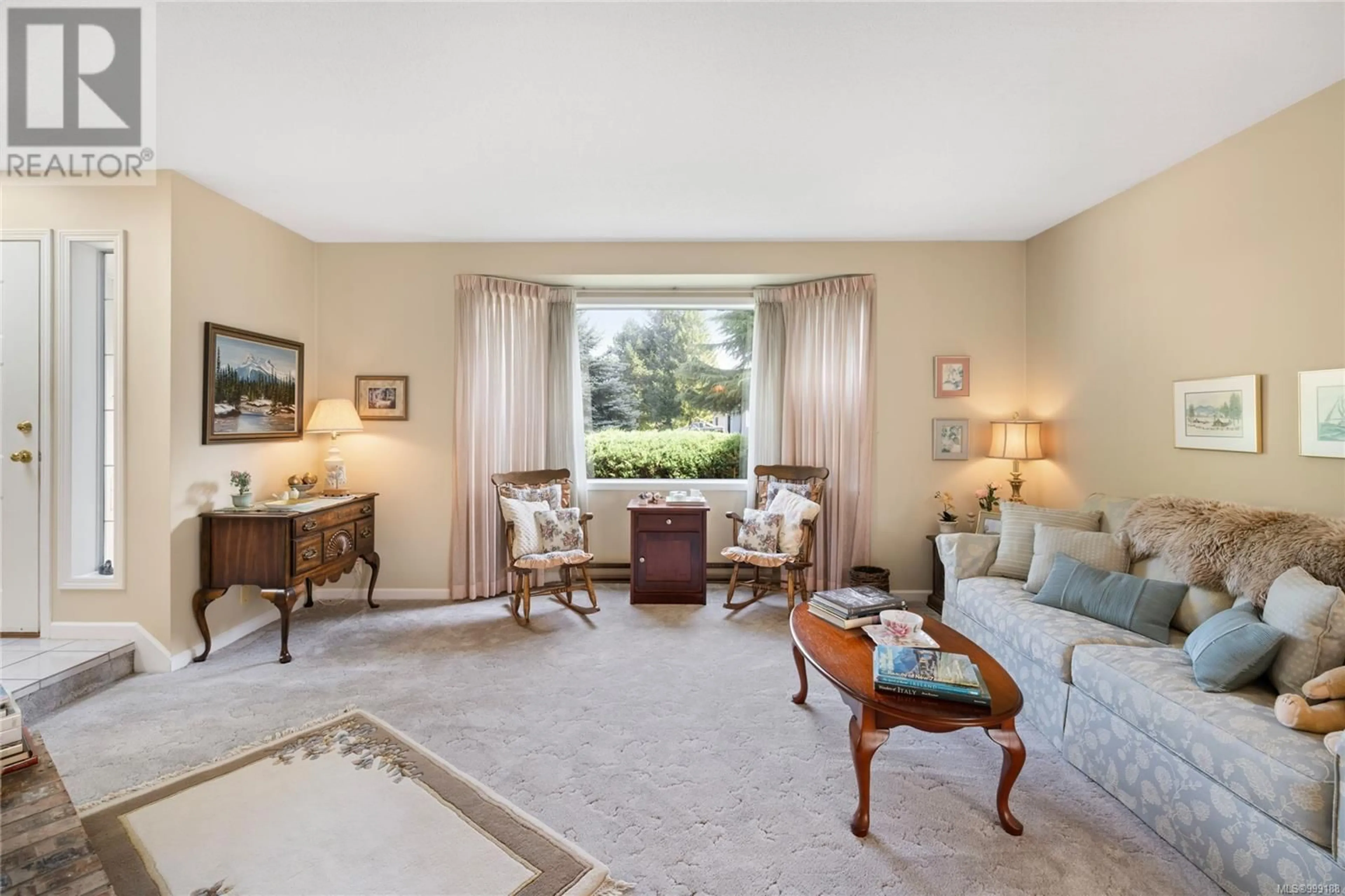 Living room with furniture, carpet floor for 591 MORESBY AVENUE, Qualicum Beach British Columbia V9K1J6
