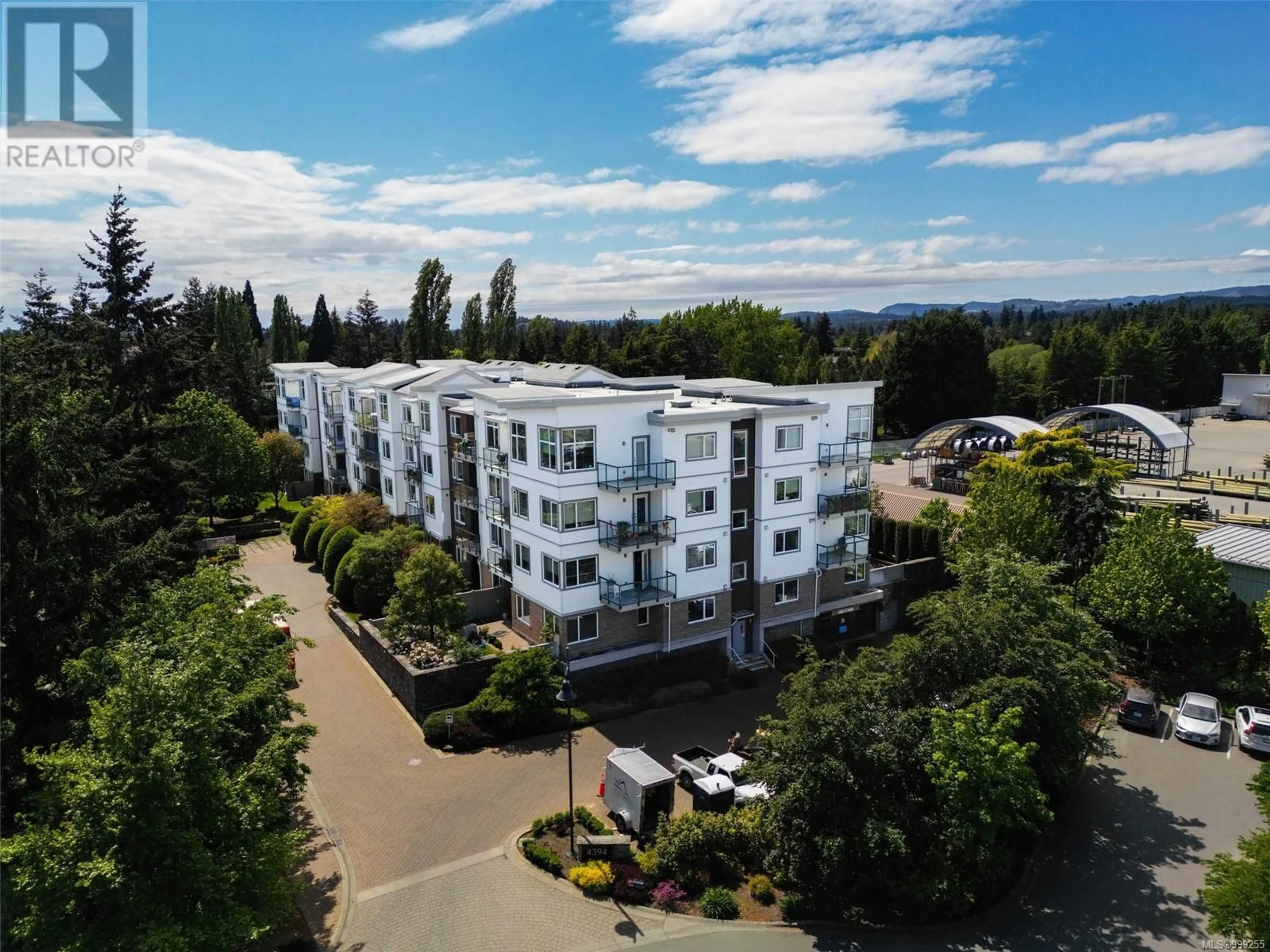 A pic from outside/outdoor area/front of a property/back of a property/a pic from drone, unknown for 304 - 4394 WEST SAANICH ROAD, Saanich British Columbia V8Z0B5