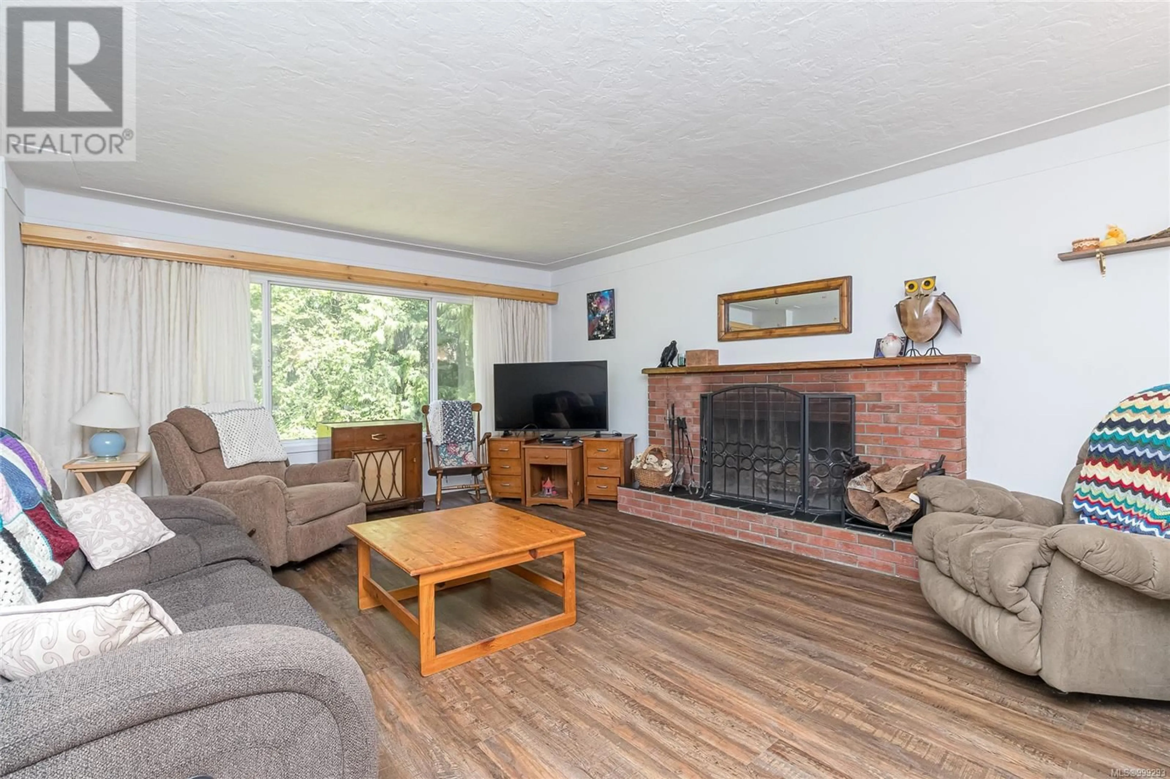Living room with furniture, wood/laminate floor for 4720 EALES ROAD, Metchosin British Columbia V9C4E1