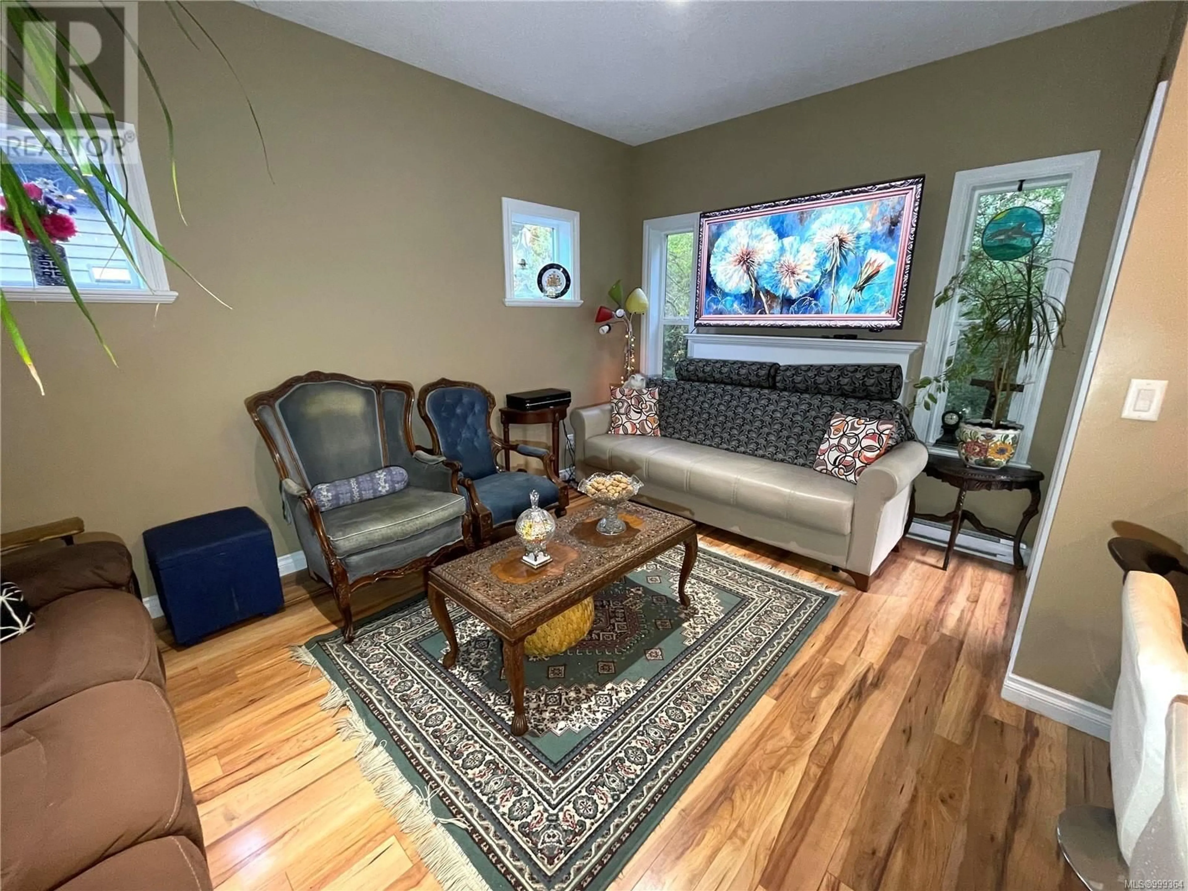 Living room with furniture, wood/laminate floor for 887 WILD RIDGE WAY, Langford British Columbia V9C0H1