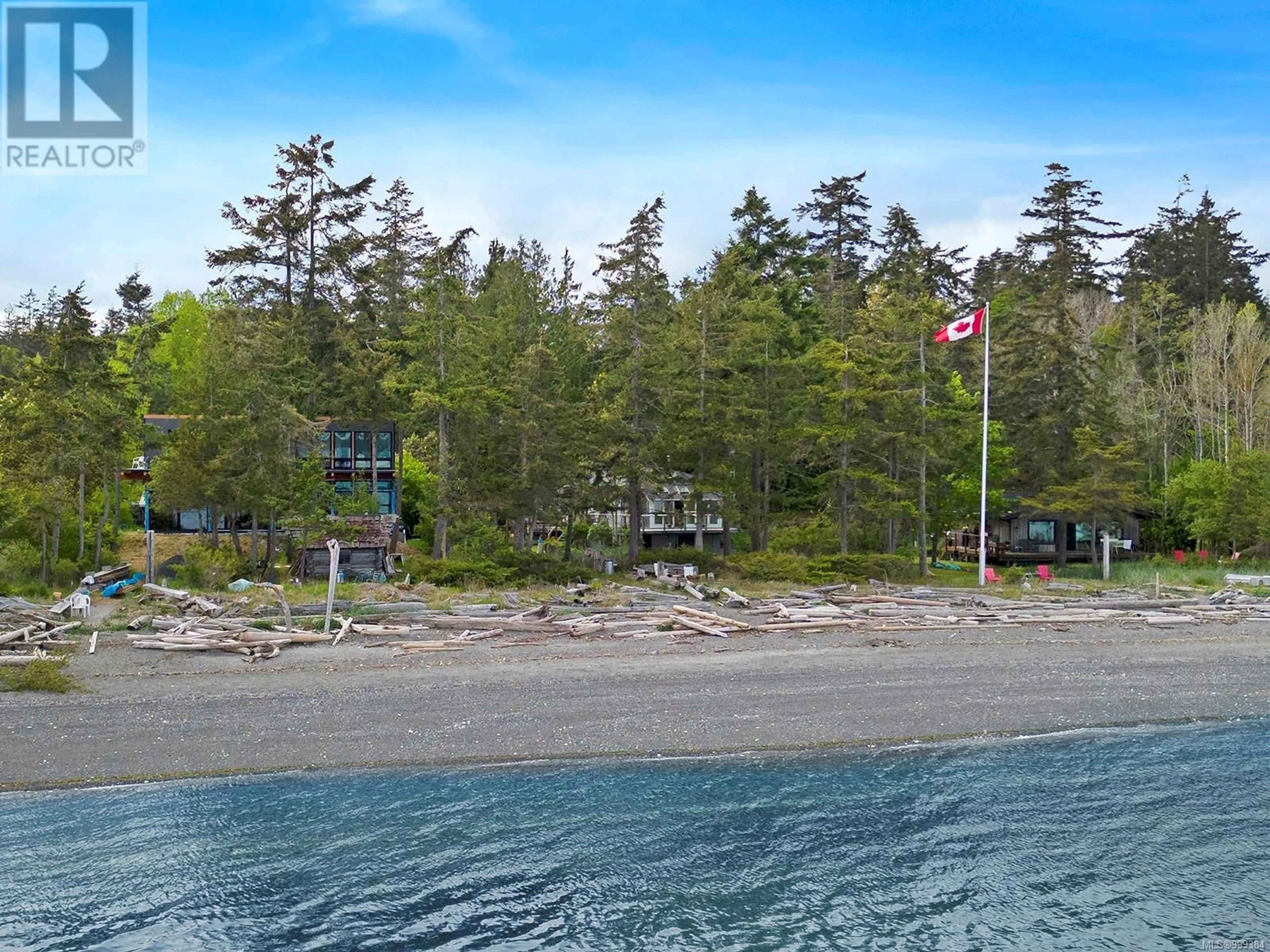 A pic from outside/outdoor area/front of a property/back of a property/a pic from drone, water/lake/river/ocean view for 1550 DALZIEL ROAD, Denman Island British Columbia V0R1T0