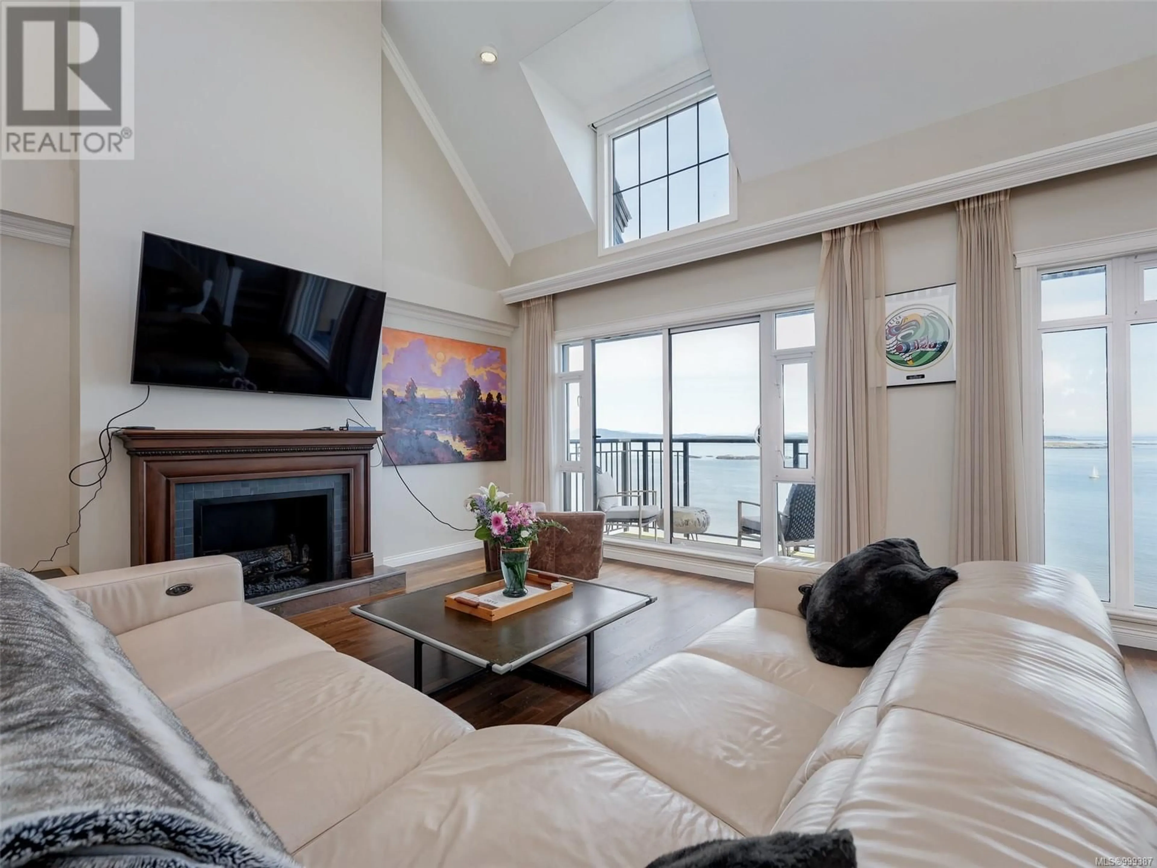 Living room with furniture, wood/laminate floor for 505 - 1175 BEACH DRIVE, Oak Bay British Columbia V8S2N2