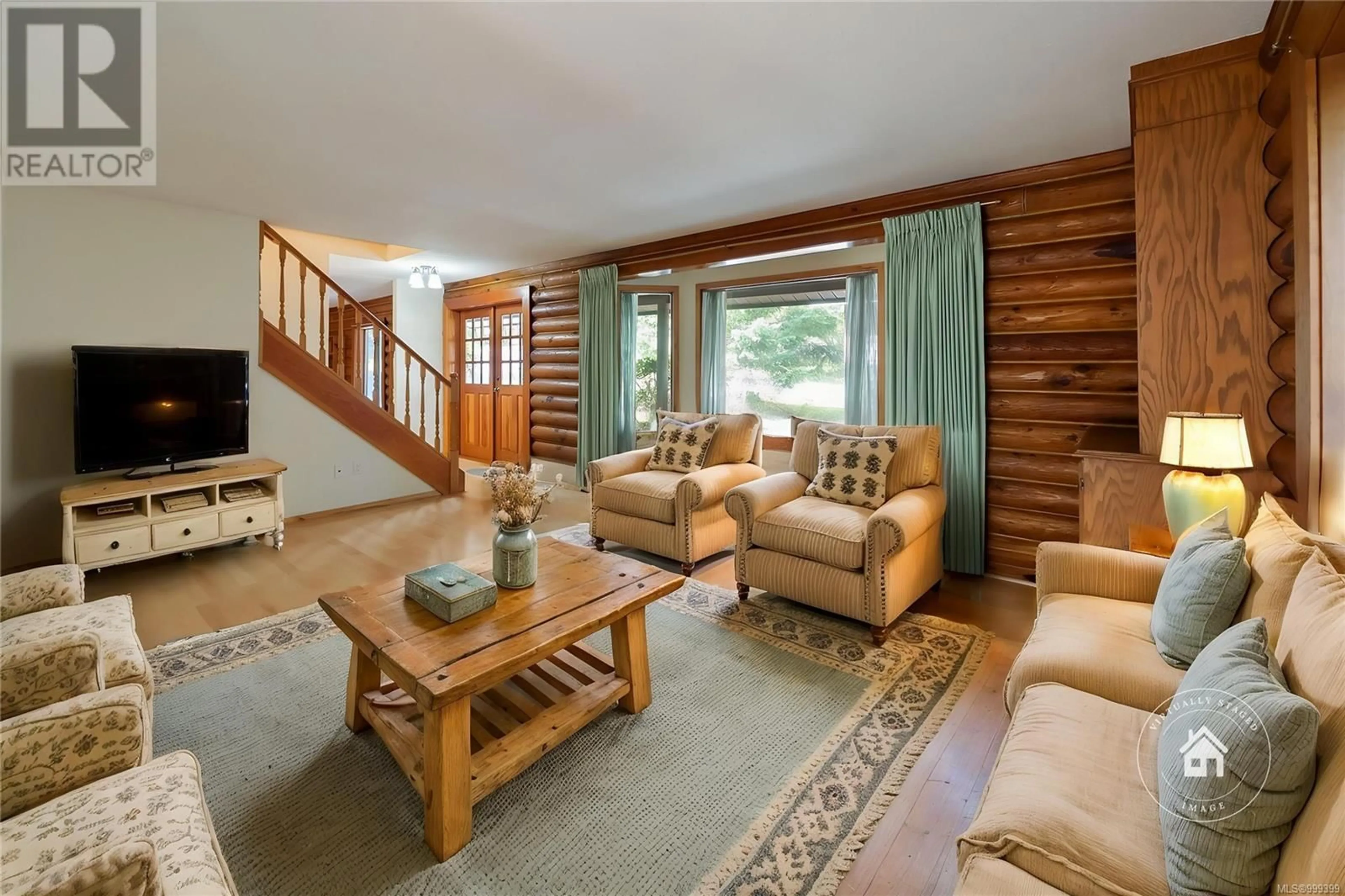 Living room with furniture, wood/laminate floor for 4847 LOST LAKE ROAD, Nanaimo British Columbia V9T5C6