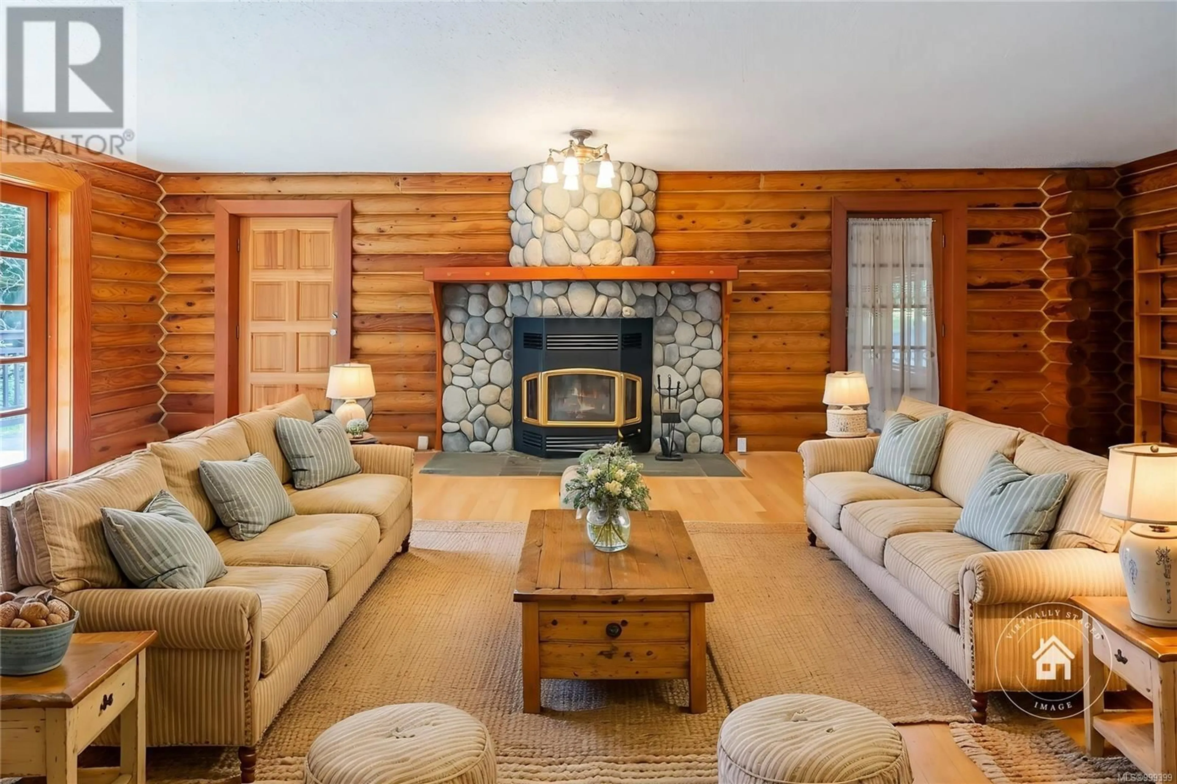 Living room with furniture, wood/laminate floor for 4847 LOST LAKE ROAD, Nanaimo British Columbia V9T5C6