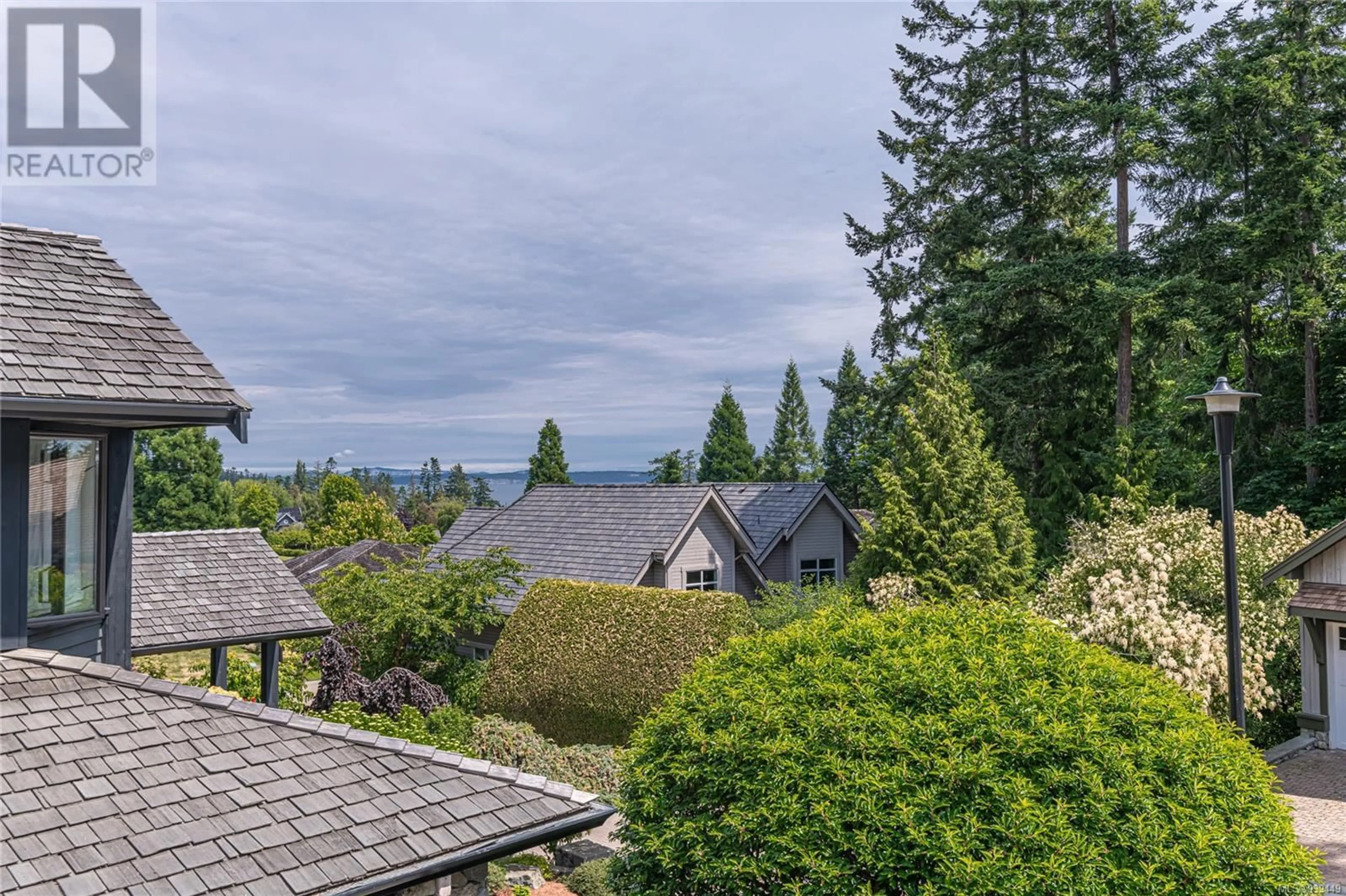 A pic from outside/outdoor area/front of a property/back of a property/a pic from drone, water/lake/river/ocean view for 5300 MYNABIRD LANE, Saanich British Columbia V8Y3H6